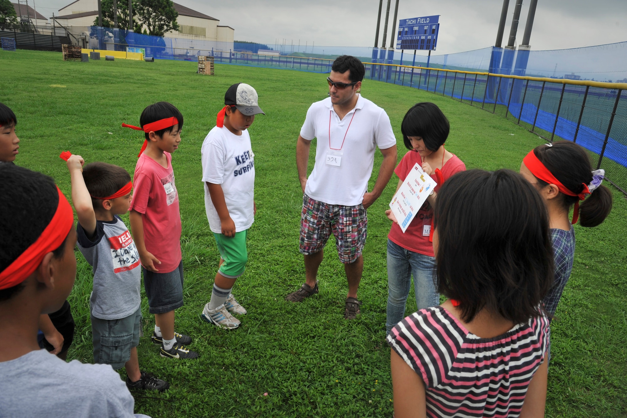 YOKOTA AIR BASE, Japan -- A group of Japanese and American children introduce themselves during a cultural friendship barbeque at Yokota Air Base, Japan, July 30, 2011. The event was hosted by Yokota's Company Grade Officers Council, Youth Center and Junior Chamber International Japan to foster interaction between Japanese and Yokota children. (U.S. Air Force photo/Senior Airman Andrea Salazar)