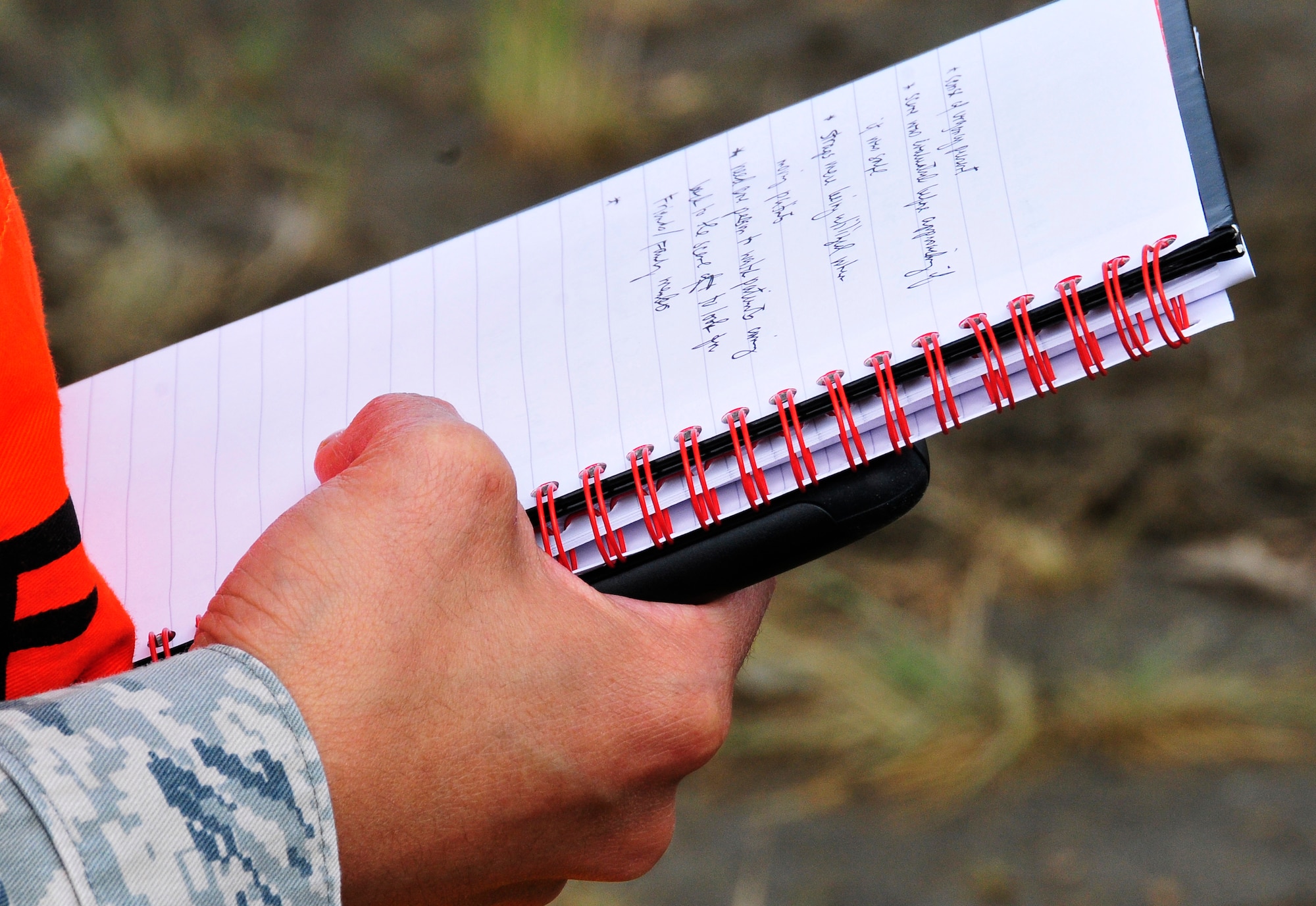 An exercise evaluation team member reviews notes during a disaster response exercise conducted at the University of Alaska, Fairbanks campus July 27, 2011, Fairbanks, Alaska.  Eielson Air Force Base teamed up with UAF's Campus Incident Management Team to test the response capabilities of emergency operations in a domestic terrorism incident. (U.S. Air Force photo/Staff Sgt. Miguel Lara III)