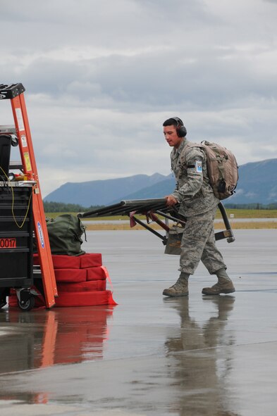 After a successful launch of the F-15 Fighter, Technical Sergeant Ryan Green of the 104th Fighter Wing, Massachusetts Air National Guard, prepares for its return. Green was promoted to Technical Sergeant on Sunday, July 31, 2011, while deployed to Joint Base Elmendorf-Richardson, Alaska in support of a training exercise. (U.S. Air Force Photo by: Technical Sergeant, Anthony M. Mutti)