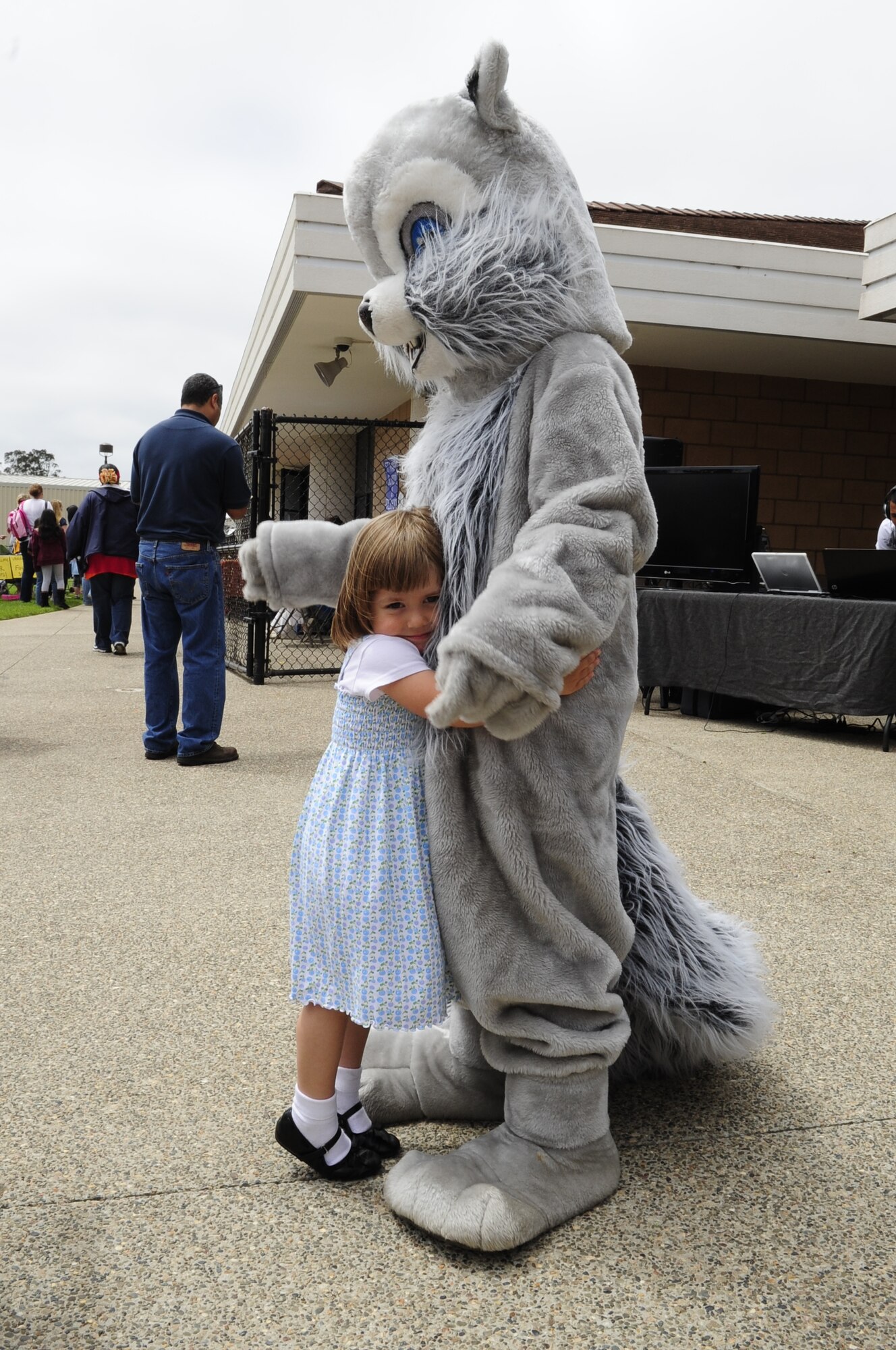 VANDENBERG AIR FORCE BASE, Calif. – Lauren Prater hugs Sammy the Squirrel, the former 30th Force Support Squadron mascot, during the Salute to Youth event at the Youth Center here Friday, July 29, 2011. The Salute to Youth was both an educational and family friendly event. The event hosted the Exceptional Family Member Program, local schools, Backpack Brigade, disc jockey, games and prizes. (U.S. Air Force photo/Senior Airman Lael Huss)