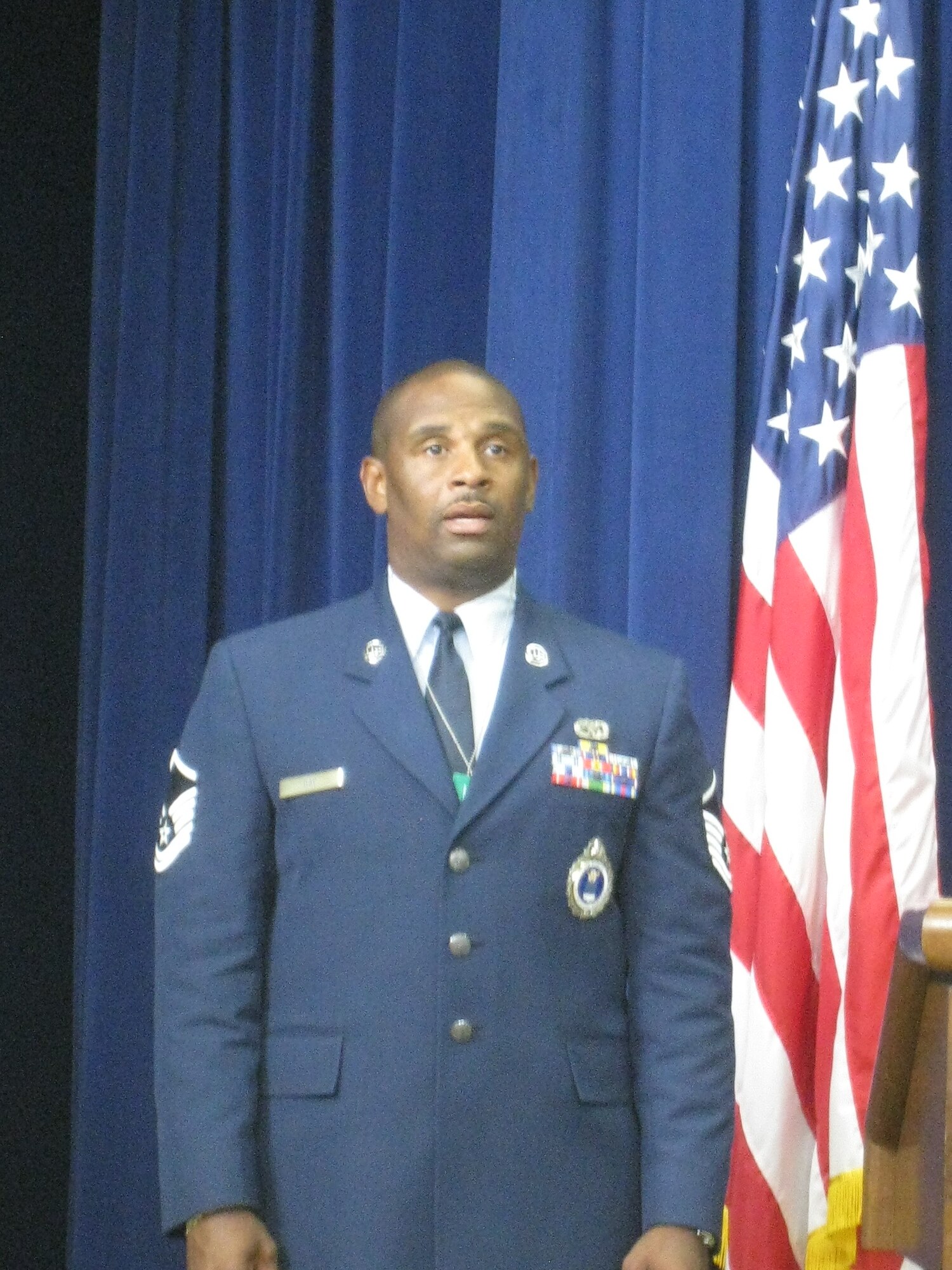 Master Sgt. Donald Day, 317th Recruiting Squadron, sings the National
Anthem at the opening ceremonies of a White House Summit July 29. The
summit, "Impacting change in America and abroad," focused on energizing
national service through goodwill and selflessness to the community. (U.S. Air Force photo/courtesy photo)
