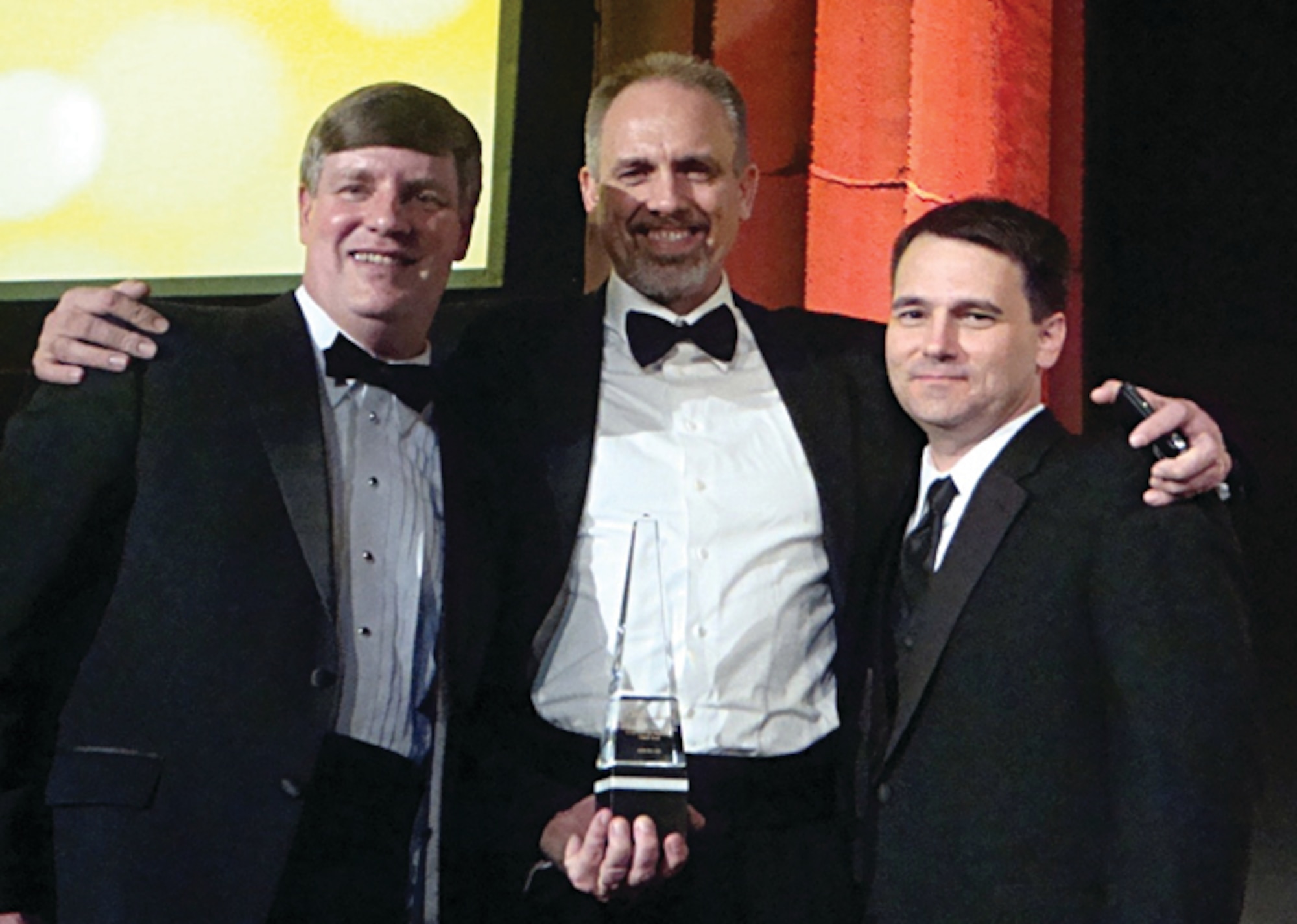 X-51A Team members Charles Brink, George Thum and Joseph Vogel accept the Aviation Week award at a black-tie dinner in March 2011 in Washington, D.C.  Awards are given based on work done the previous calendar year.   (Air Force Image)