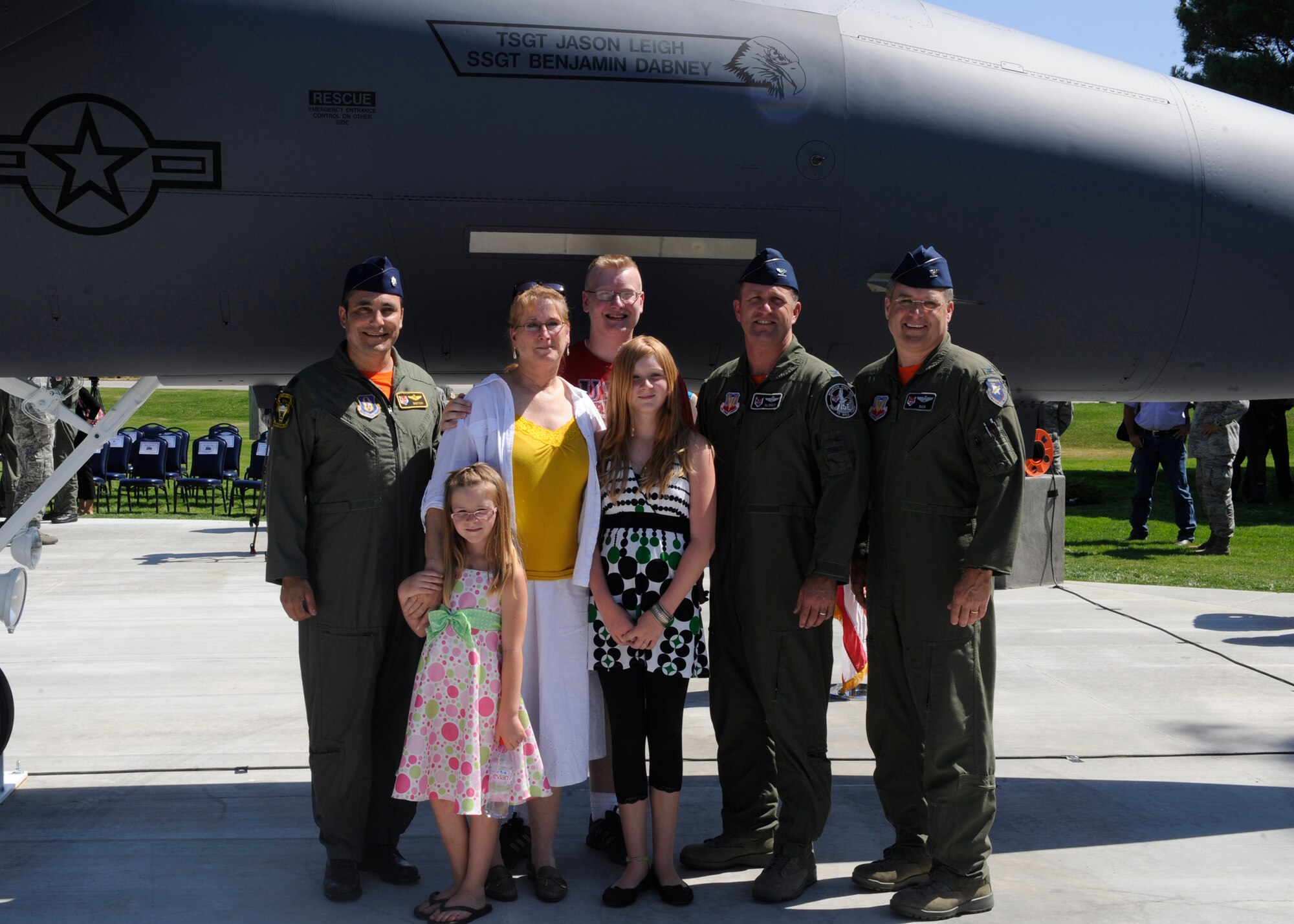 MOUNTAIN HOME AIR FORCE BASE, Idaho – Senior leaders pose for a photo here July 29 with the family of Tech. Sgt. Jason Leigh, a former 366th Equipment Maintenance Squadron member who was killed April 2010 in a motorcycle accident while on temporary duty in Las Vegas, Nev. The F-15 E Strike Eagle was dedicated to honor the men and women of the 366th Fighter Wing. (U.S. Air Force photo by Senior Airman Angelina Drake)