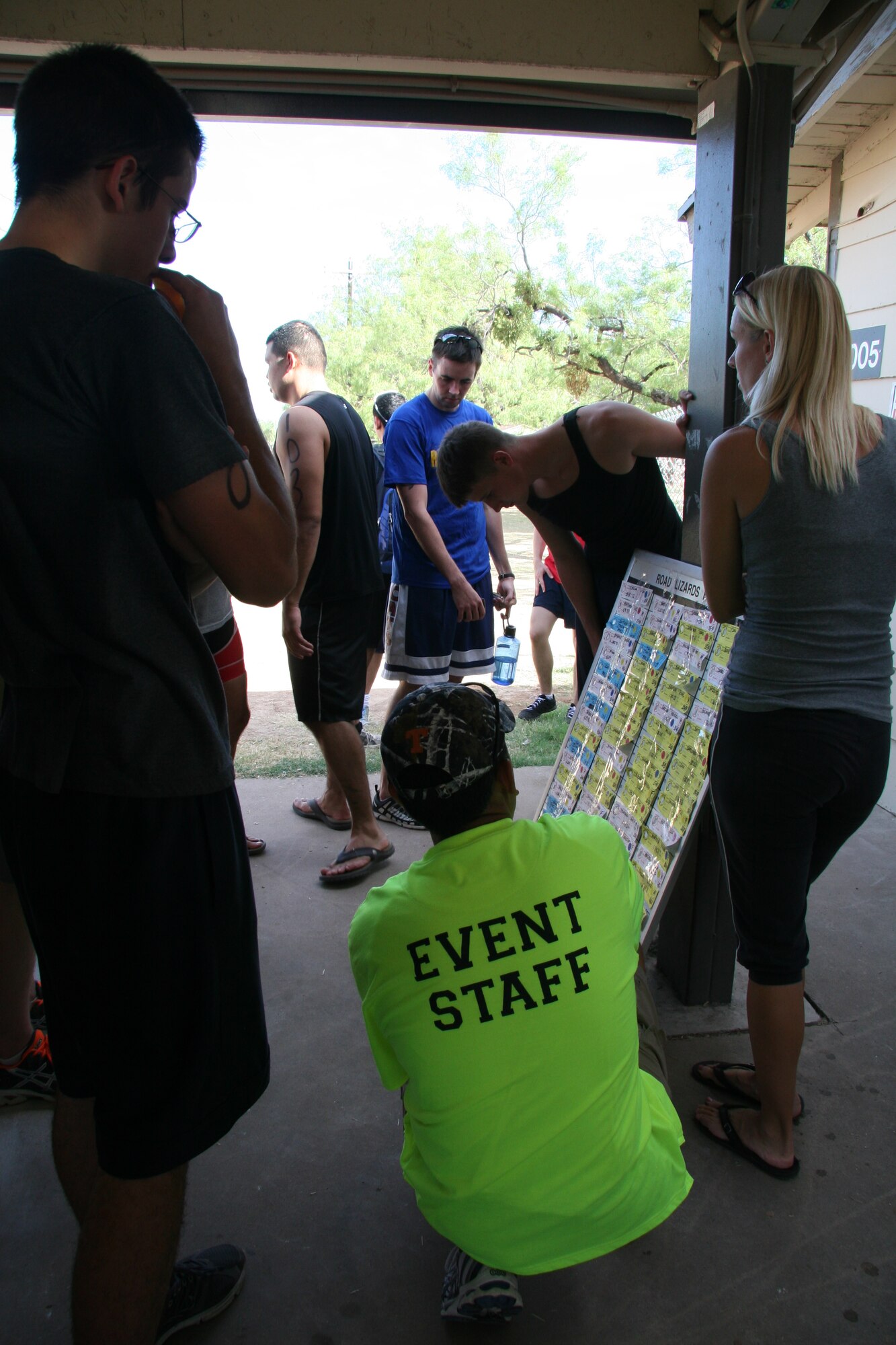GOODFELLOW AIR FORCE BASE, Texas – Participants check their times for the 400-meter open water swim, 20-kilometer bike ride and 5-kilometer run during the  2011 triathlon at the Outdoor Recreation Camp July 30. (Courtesy photo/Julie Manuel)
