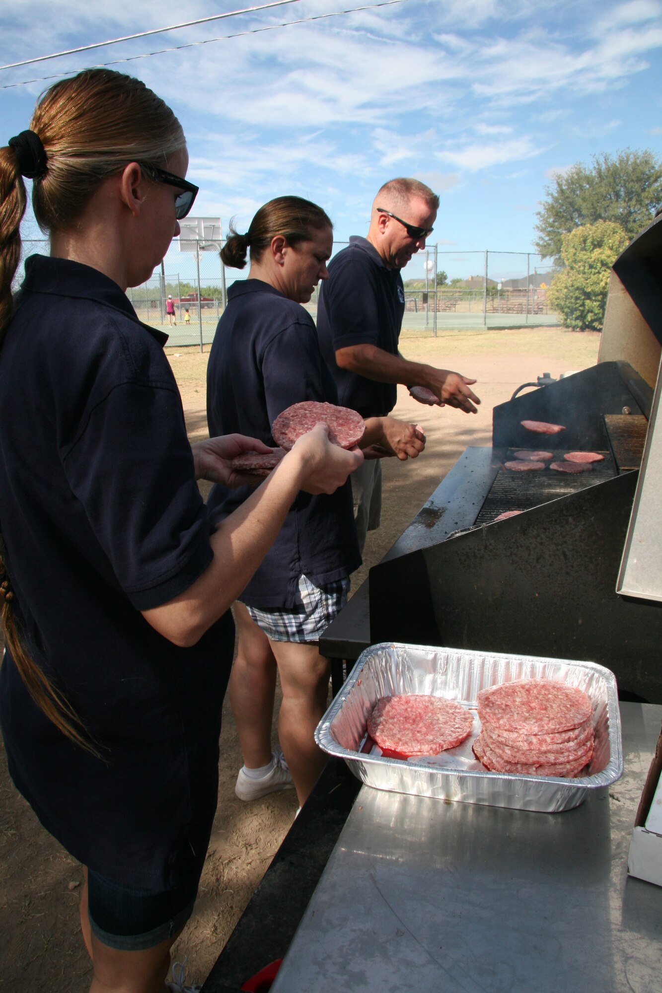 GOODFELLOW AIR FORCE BASE, Texas – Goodfellow first sergeants fired up the grill to feed the contestants and their supporters during the 2011 triathlon at the Outdoor Recreation Camp July 30. More than 150 people from Goodfellow and the local community participated in the event. (Courtesy photo/Julie Manuel)