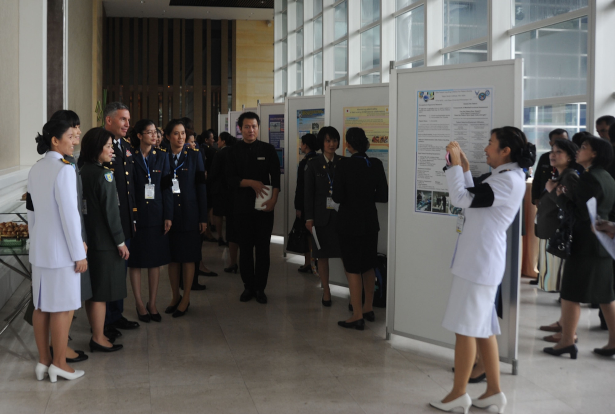 BANGKOK, Thailand - Members of the military nursing community take photos with one another at the Pullman King Power Hotel in Bangkok Thailand on Aug. 1 during the start of a five-day 2011 Asia Pacific Military Nursing Symposium, which is sponsored by Pacific Command and executed under the direction of 13th Air Force.
This is the fifth year of the symposium, which started at Hickam Air force Base in 2007, and the first time that Thailand has hosted the event.
More than 12 countries from the Asia-Pacific region have come together to build on relationships by exchanging information and techniques with one another. 
(U.S.  Air Force photo/Master Sgt. Cohen A. Young)
