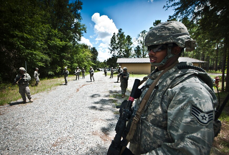 U.S. Air Force Staff Sgt. Richard Morris, 823rd Base Defense Squadron fireteam member, leads the team into the military operations in urban terrain village training facility during the squad leadership course at Moody Air Force Base, Ga., July 29, 2011. The course is an entry-level leadership course to prepare individuals to one day lead their own group of Airmen from an experienced security forces perspective. (U.S. Air Force photo by Airman 1st Class Joshua Green/Released)

