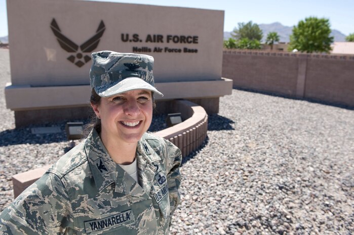U.S. Air Force Col. Carol C. Yannarella, 99th Air Base Wing vice commander, stands near the front gate July 21, 2011, at Nellis Air Force Base, Nev. Yannarella supports the installation command authority for Nellis and Creech Air Force Bases and the 2.9 million-acre Nevada Test and Training Range. She is responsible for all installation support, which includes providing communications, contracting, engineering, environmental, law enforcement, logistics, medical, security, services, supply, transportation and mission support, for more than 12,000 assigned personnel and 313,000 dependents, retirees and veterans. In addition, the 99th Air Base Wing supports the U.S. Air Force Warfare Center, 57th Wing, 432nd Wing and elements of the 53rd Wing, 505th Command and Control Wing and 23rd Wing. There are 171 fixed- and rotary-wing aircraft assigned to Nellis and nearly 1,500 visitors and temporary-duty personnel conduct business at Nellis daily. (U.S.Air Force photo by Airman 1st Class Matthew Lancaster/Released)