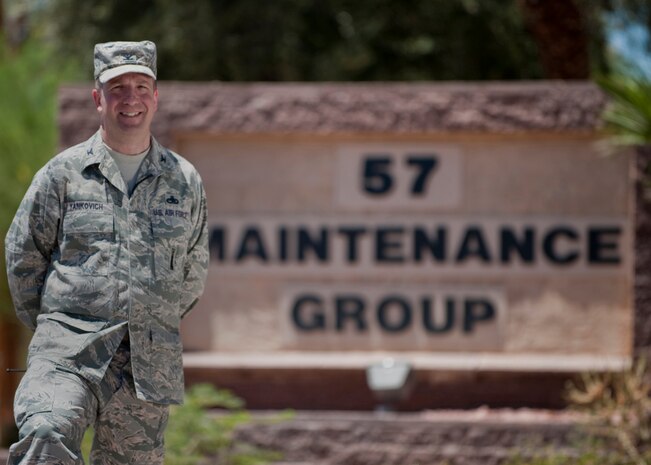 U.S. Air Force Col. Joseph Yankovich, 57th Maintenance Group commander, stands in front of the group's headquarter building July 15, 2011, at Nellis Air Force Base, Nev. Yankovich assumed command of the 57 MXG July 8, 2011, and is responsible for 2,200 Airmen and contractors who perform aircraft and munitions maintenance, generate sorties, and meet strict test, tactics and training requirements. (U.S. Air Force Photo by Airman 1st Class Jamie L. Nicley/Released)
