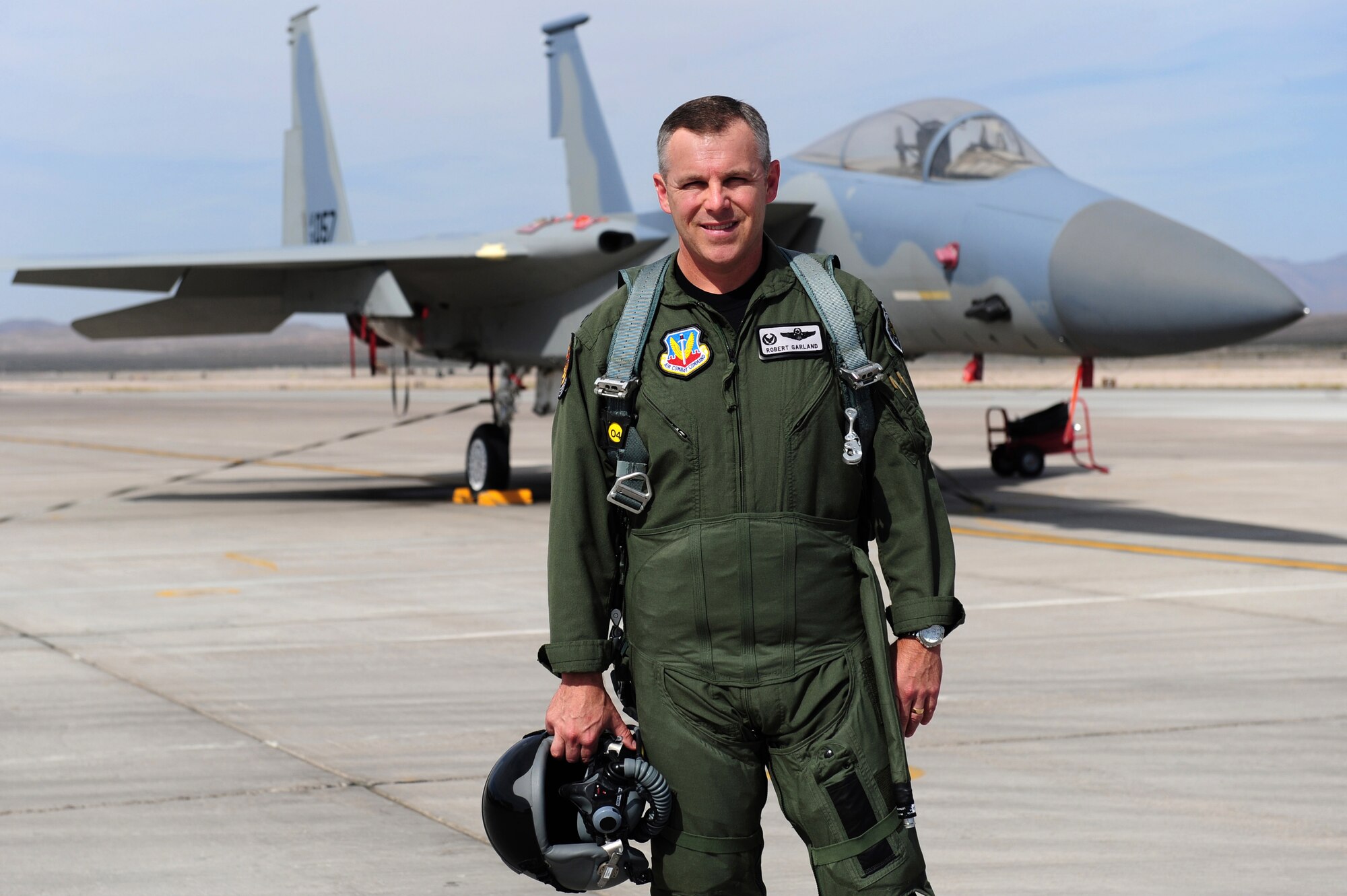 U.S. Air Force Col. Robert A. Garland Jr. stands in front of an F-15 Eagle aircraft June 17, 2011, on the flightline at Nellis Air Force Base, Nev.  Garland is the U.S. Air Force Weapons School commandant.  He commands 17 squadrons with over 250 assigned instructors to provide graduate-level training in weapons and tactics employment to officers of the combat air forces and mobility air forces.  The school also produces the Weapons Review magazine, the CAF's premier professional tactics publication.
(U.S. Air Force photo by Staff Sgt. William P.Coleman)
