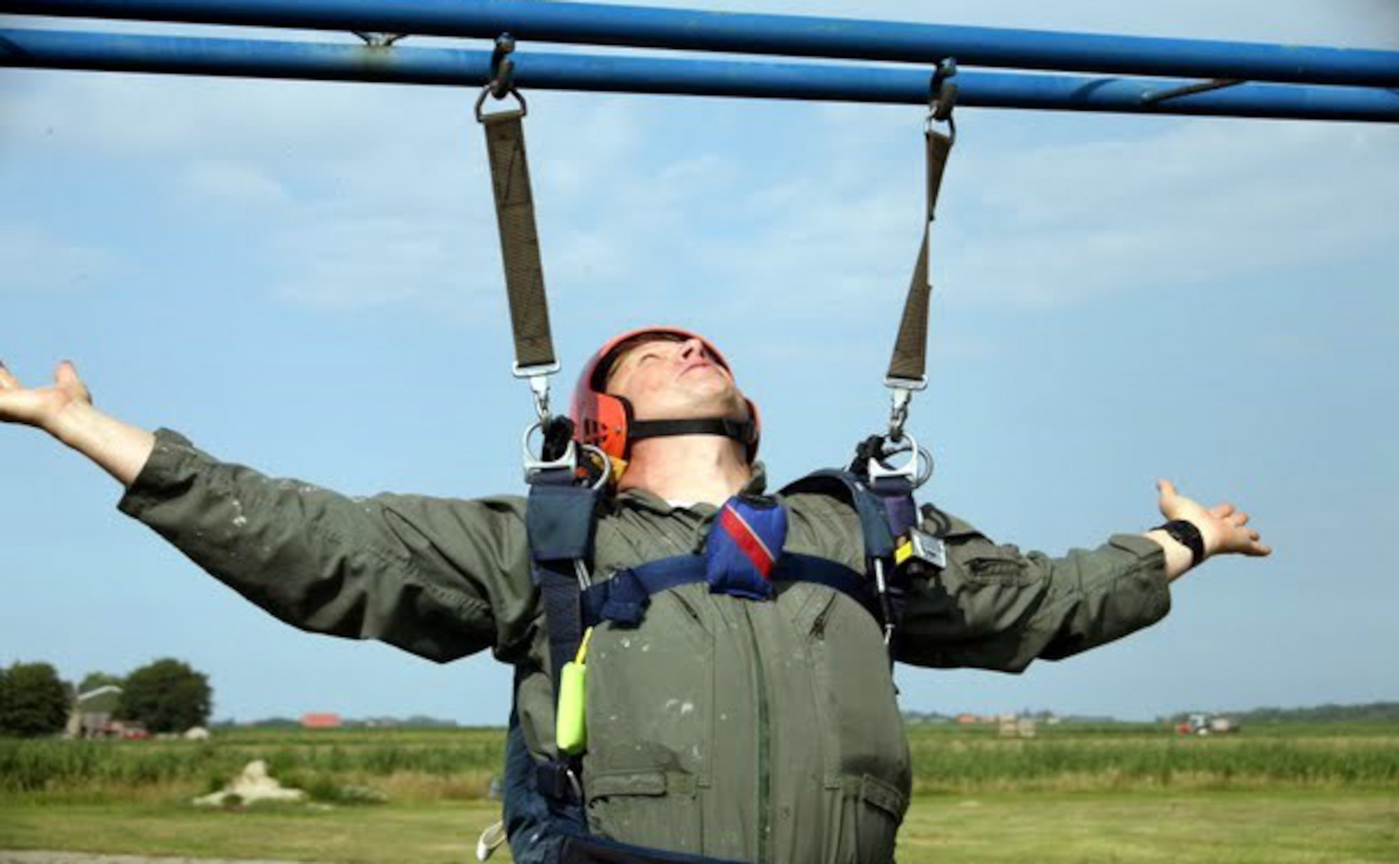 TEXEL, Netherlands - Maj. John Seffern, Eighth Air Force plans, programs and requirements, practices in the hanging harness before making jumps at the NATO Jump School in Texel, Netherlands. Seffern is the oldest person to complete the school. (Courtesy photo)