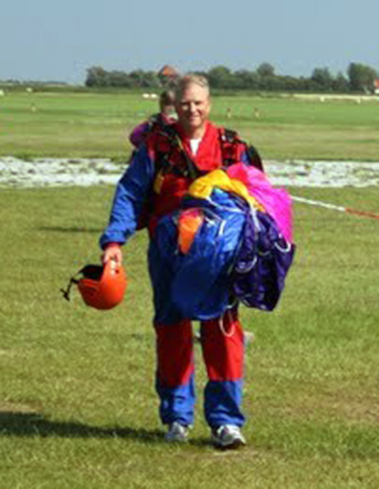 TEXEL, Netherlands - Maj. John Seffern, Eighth Air Force plans, programs and requirements, walks back to a hangar after landing from his final jump at the NATO Jump School in Texel, Netherlands. Seffern is the oldest person to complete the school. (Courtesy photo)