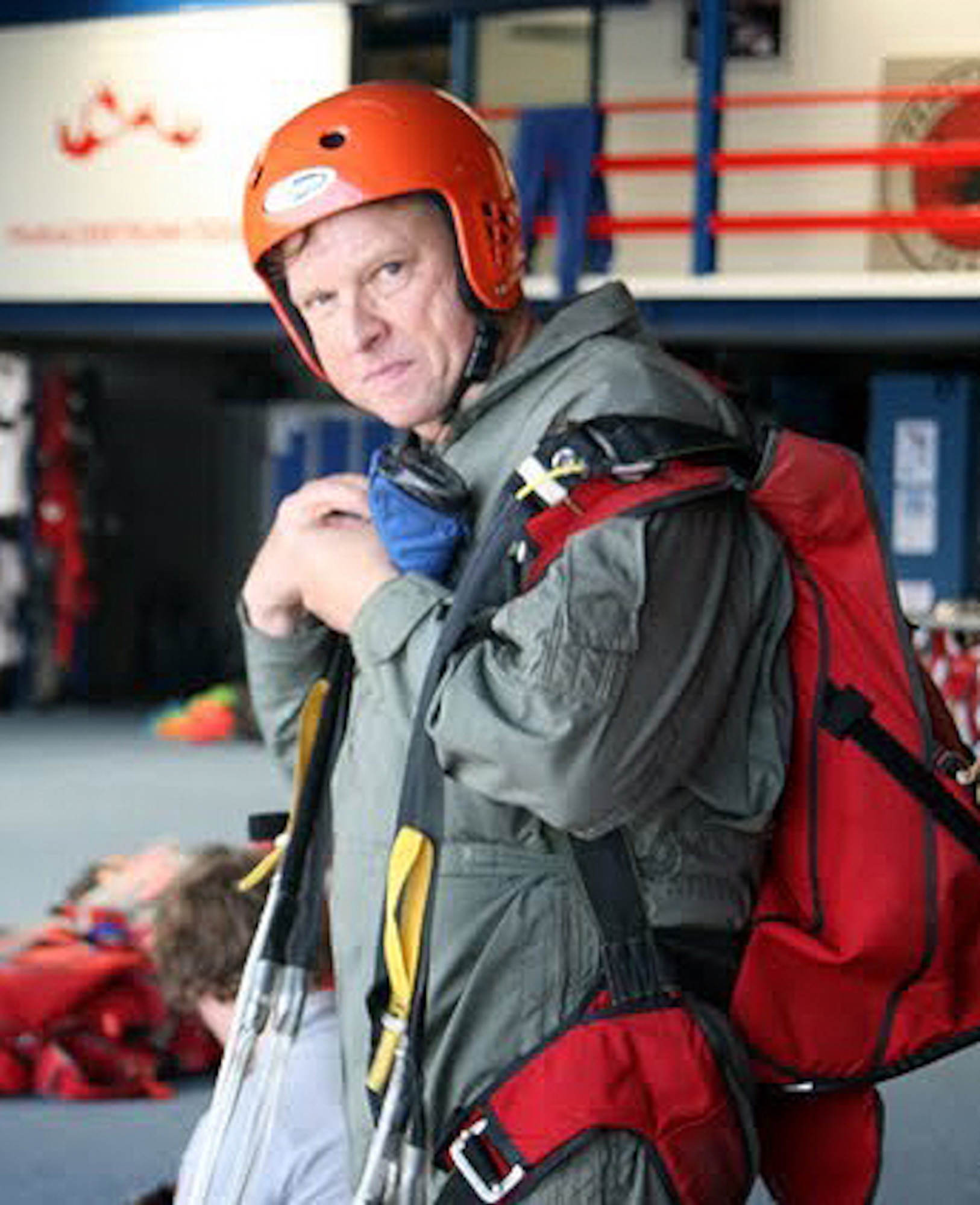 TEXEL, Netherlands - Maj. John Seffern, Eighth Air Force plans, programs and requirements, removes his gear after landing from a jump at the NATO Jump School in Texel, Netherlands. Seffern is the oldest person to complete the school. (Courtesy photo)