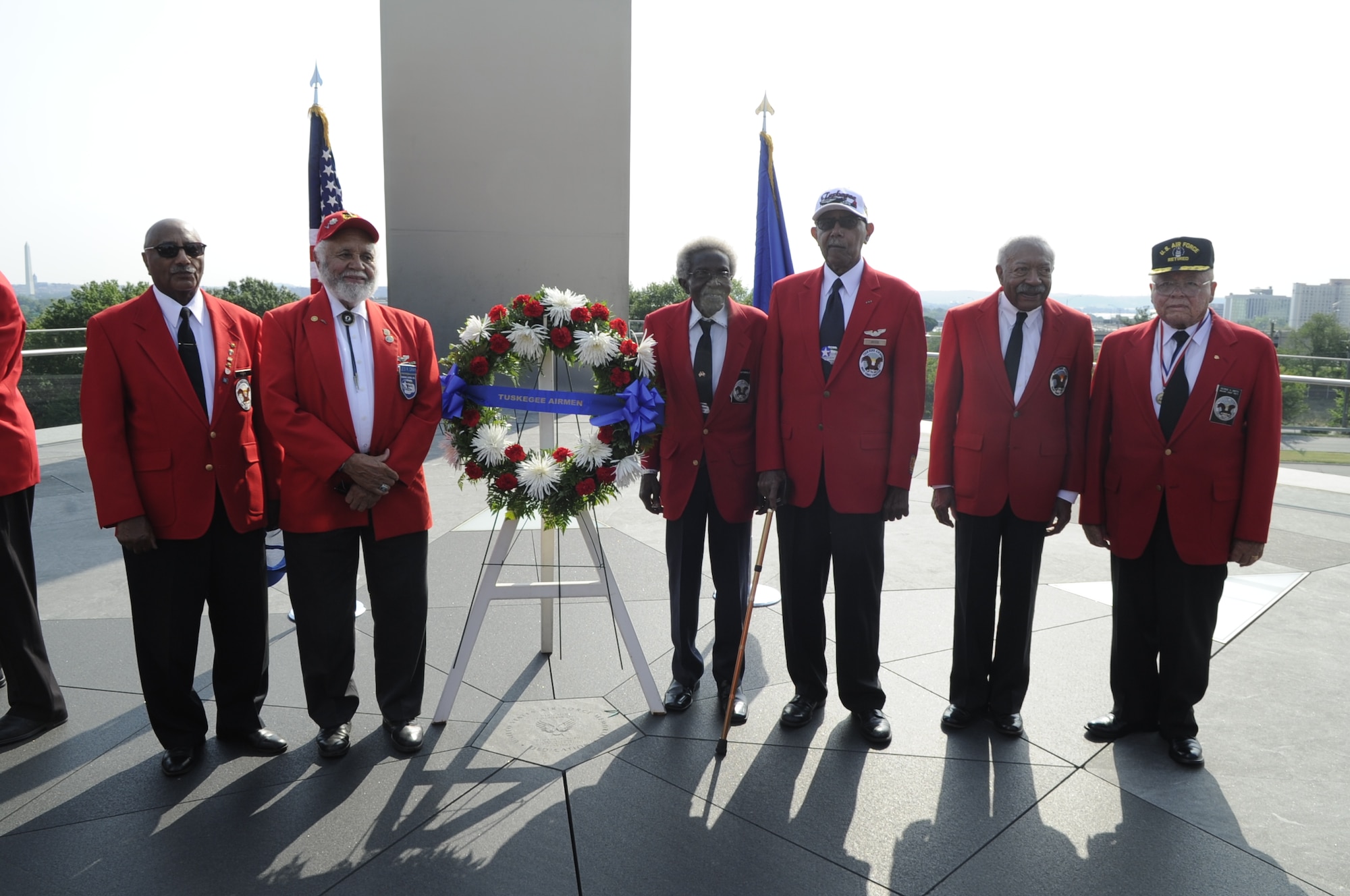 Tuskegee Airmen Association members attend a wreath laying ceremony July 31 at the Air Force Memorial in Washington, D.C. The Tuskegee Airmen were the first African American military aviators in the United States armed forces. The Tuskegee Airmen flew with the 332nd Fighter Group, the only operational unit first sent overseas as part of Operation Torch, then in action in Sicily and Italy, before being deployed as bomber escorts where they were particularly successful in their missions. (U.S. Air Force photo by Staff Sgt. Raymond Mills) 