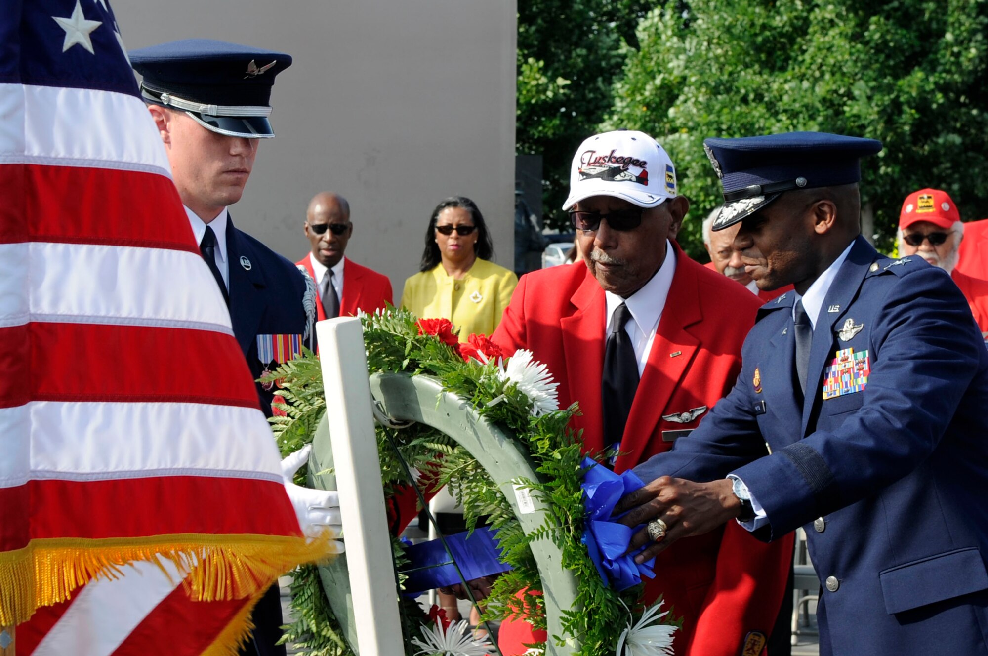 Maj. Gen. Darren W. McDew, Air Force District of Washington commander, and Jim Pryde, a Tuskegee Airman, lay a wreath July 31 at the U.S. Air Force Memorial in Washington, D.C. Pryde served with the Army Air Corps 477th Medium Bombardment Group as a combat crewman. During his tenure, he accrued 1,600 flight hours before continuing his civil service career as an intelligence analyst with the Armed Forces Security Agency. (U.S. Air Force photo by Staff Sgt. Raymond Mills)