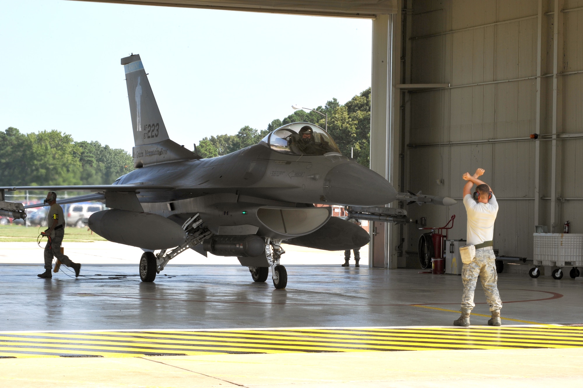 Tech Sgt.  Keith Varden (far right) and Senior Airman Jeremy Devlin, 158th Fighter Wing F crew chiefs, and Maj. Nathan Graber, 158th Fighter Wing pilot, prepare to launch an F-16 Fighting Falcon at Langley Air Force Base, Va. Aug. 1, 2011.  This was part of an ‘alert’ exercise in which the 158th FW Airmen, an Air National Guard unit based out of Vermont, immediately scramble aircraft to support homeland defense.  (U.S. Air Force photo by Staff Sgt. Logan Tuttle/Released)