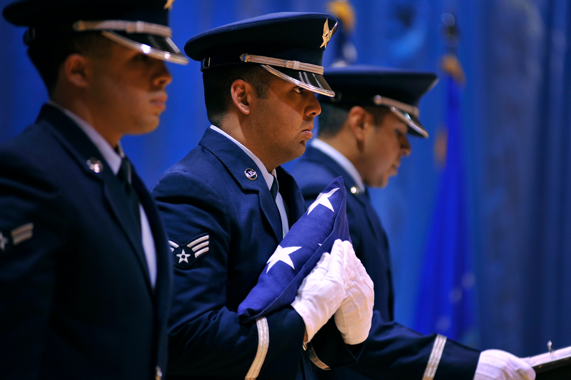 From left, Airman 1st Class Ignacio Livent-Payano, Senior Airman Taylor Vidinha, and Staff Sgt. Joshua Van Dusen, Shaw Air Force Base Honor Guard, perform a flag folding ceremony Aug. 2, 2011, Sumter S.C. The Shaw Honor Guard performed a flag folding presentation for more than 100 local children to teach them proper flag etiquette. (U.S. Air Force photo by Senior Airman Kenny Holston)(Released) 

