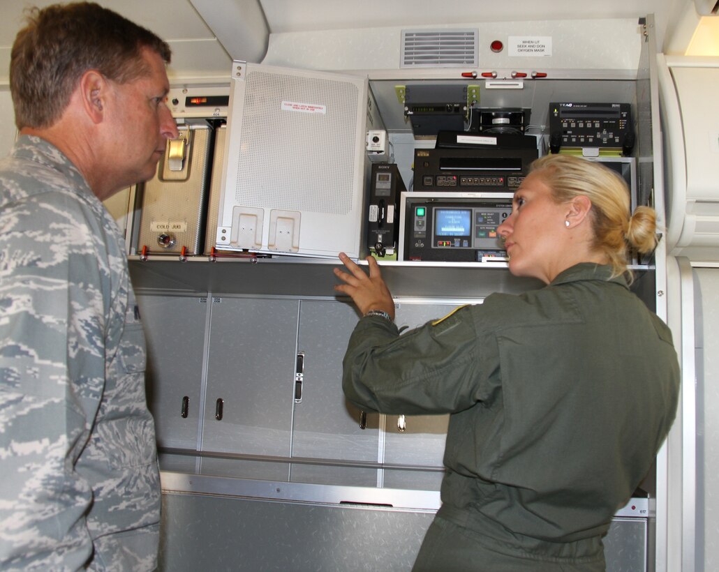 Brig. Gen. Derek Rydholm,  Air Force Reserve Command inspector general, listens  to  flight attendant Tech. Sgt. Jessie Gunderman talk about the audio-visual equipment that's located in the C-40C's galley. General Rydholm and his IG team were visiting the 932nd Airlift Wing, to conduct an Unit Compliance Inspection. The 932nd AW  was evaluated in operations, mission support and other  areas.  The 932nd AW is the only AFRC flying wing that flies the C-40C. The C-40C is used to provide world-class airlift for U.S. national and military leaders. (U.S. Air Force photo/Tech. Sgt. Chris Parr)