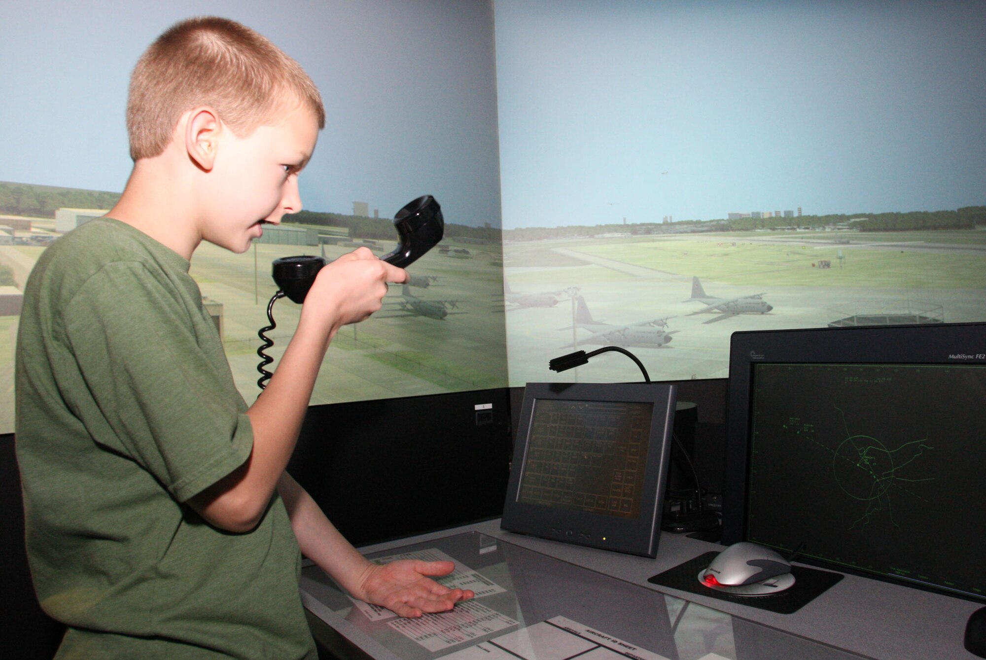 Kids experienced the challenges of working in an air traffic control environment as they tried out the ATC simulator. (U.S. Air Force Photo/Don Peek)