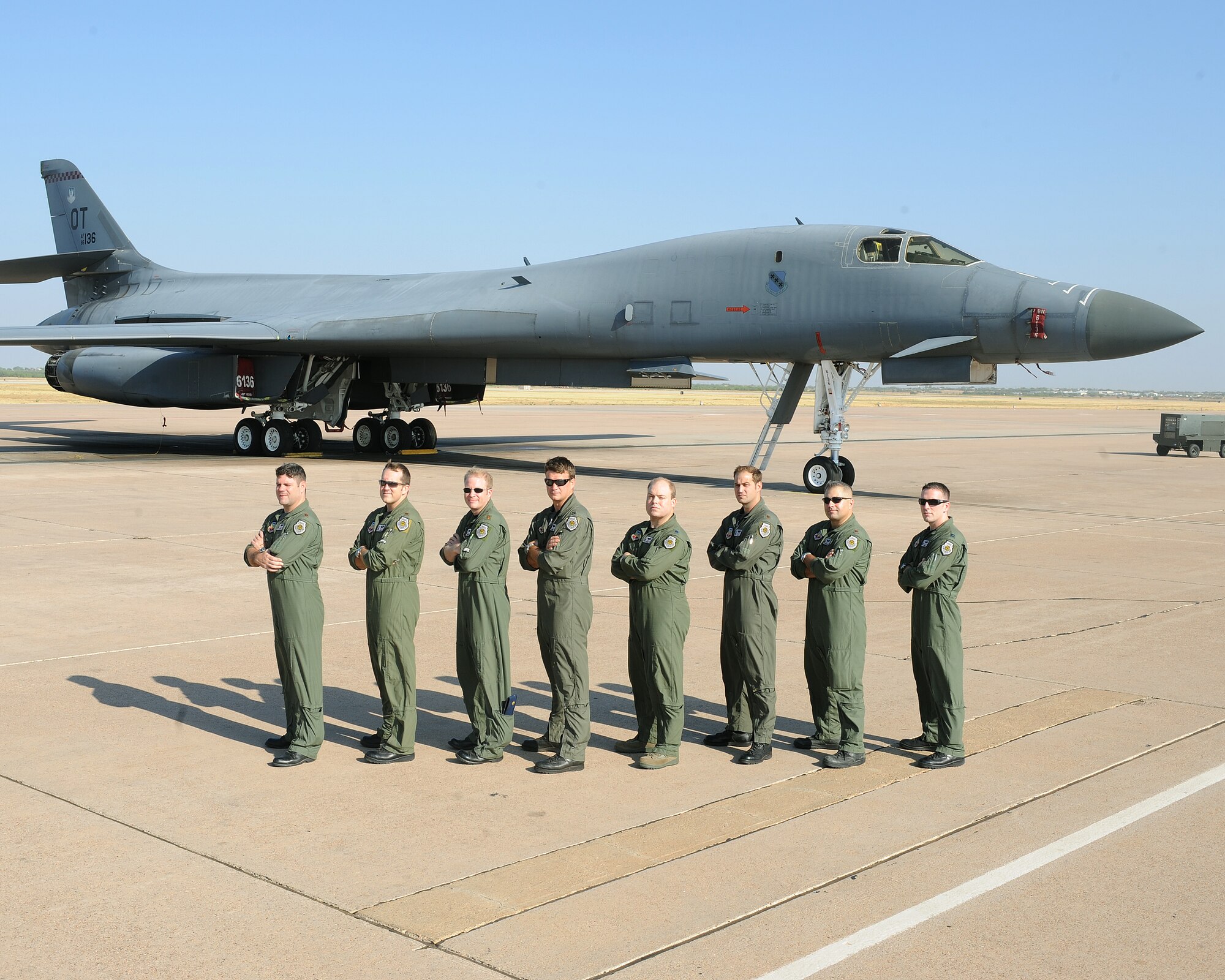 Instructors from the 77th Weapons School pose in front of a B-1 Bomber July 22, 2011 on the flight line Dyess AFB, Texas. Each instructor has been through the weapons school course and has served as squadron weapon officers prior to becoming an instructor. (U.S. Air Force photo by Tech. Sgt. Darcie Ibidapo/ Released)