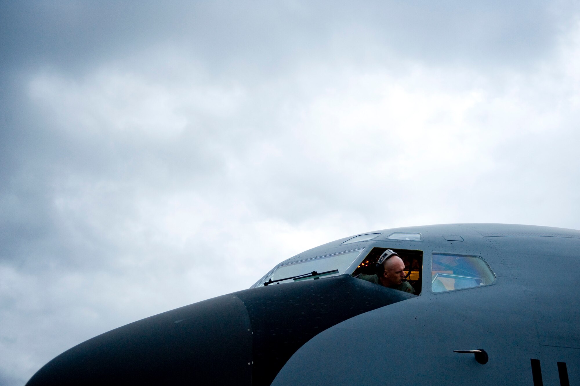 Major Nathan Diaz, a KC-135 Stratotanker pilot with the 63rd Air Refueling Squadron, performs pre-flight checks before his flight during Air Mobility Command's Rodeo 2011 at Joint Base Lewis-McChord, Wash., July 26, 2011. Large Package Week is an exercise that utilizes several Air Force C-130 and C-17 aircraft to strategically airdrop troops and cargo onto a specified location in prepAration for real world contingency response. (U.S. Air Force photo by Staff Sgt. Greg C. Biondo)