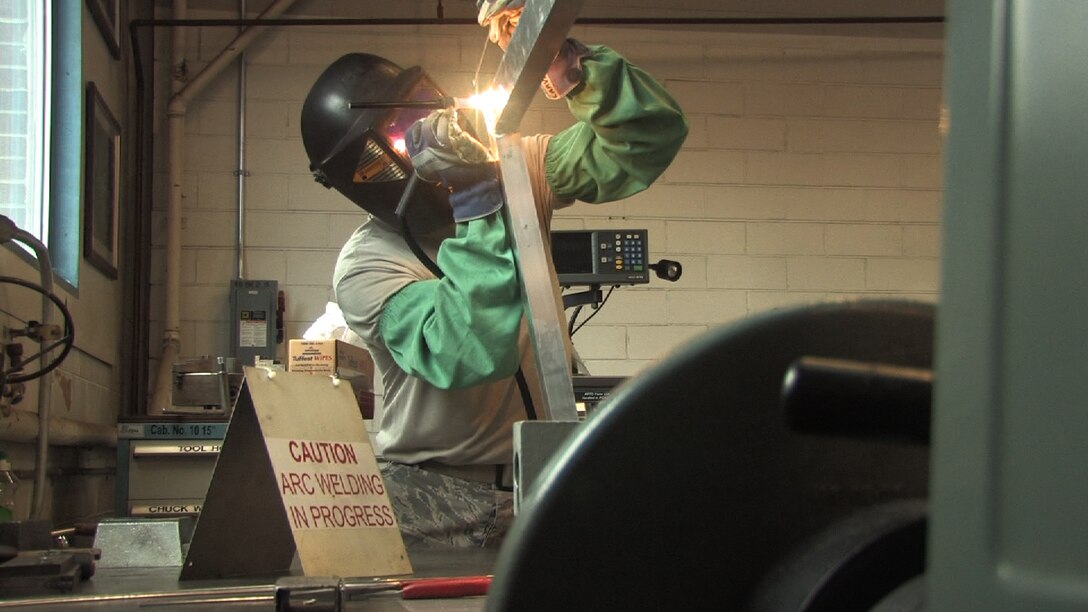 Staff Sgt. David Larva, 934th aircraft metal technologist, welds a Civil engineer gate door while on seasoning training.  Seasoning training gives Reservists who are recent technical school graduates the chance to receive on the job training for up to 90 days. (Air Force Photo/Wendy Cormier) 