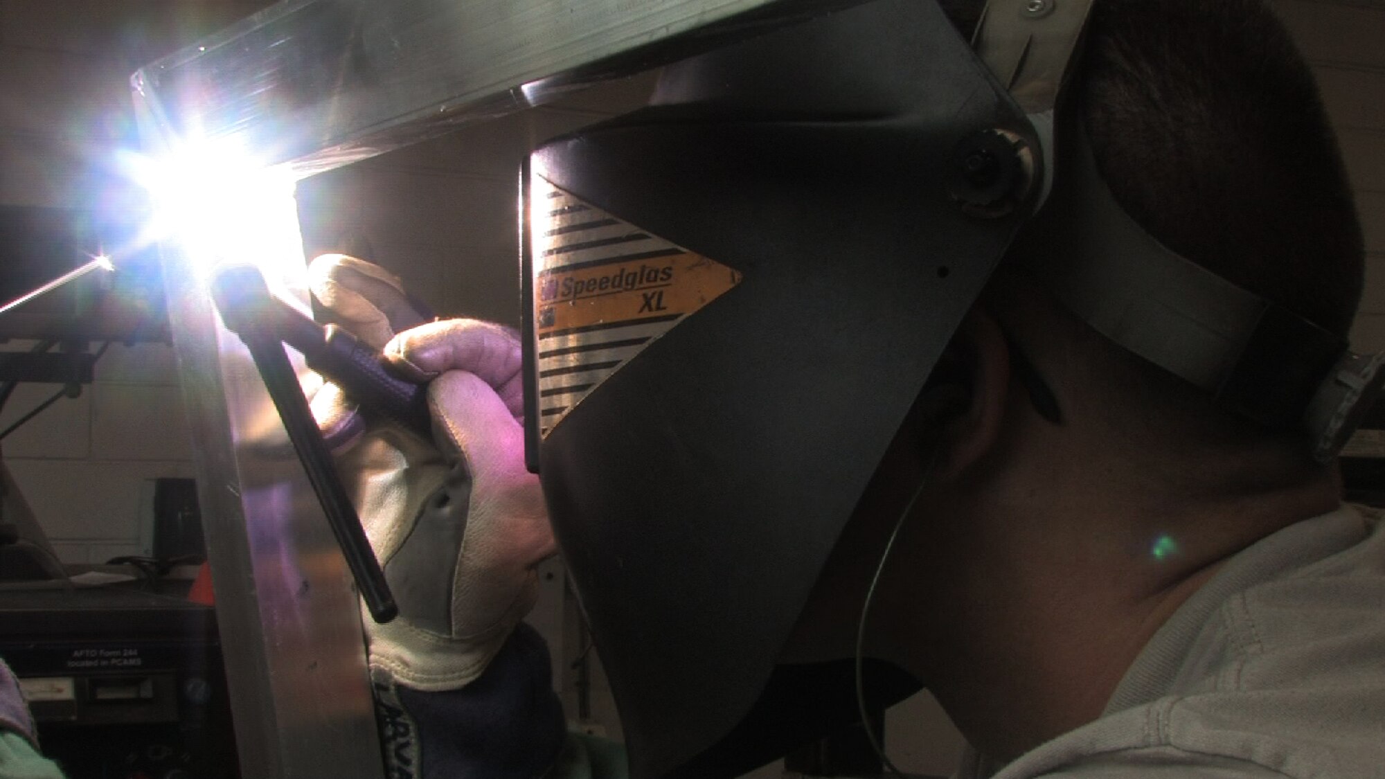 Staff Sgt. David Larva, 934th aircraft metal technologist, welds a Civil engineer gate door while on seasoning training.  Seasoning training gives Reservists who are recent technical school graduates the chance to receive on the job training for up to 90 days. (Air Force Photo/Wendy Cormier) 