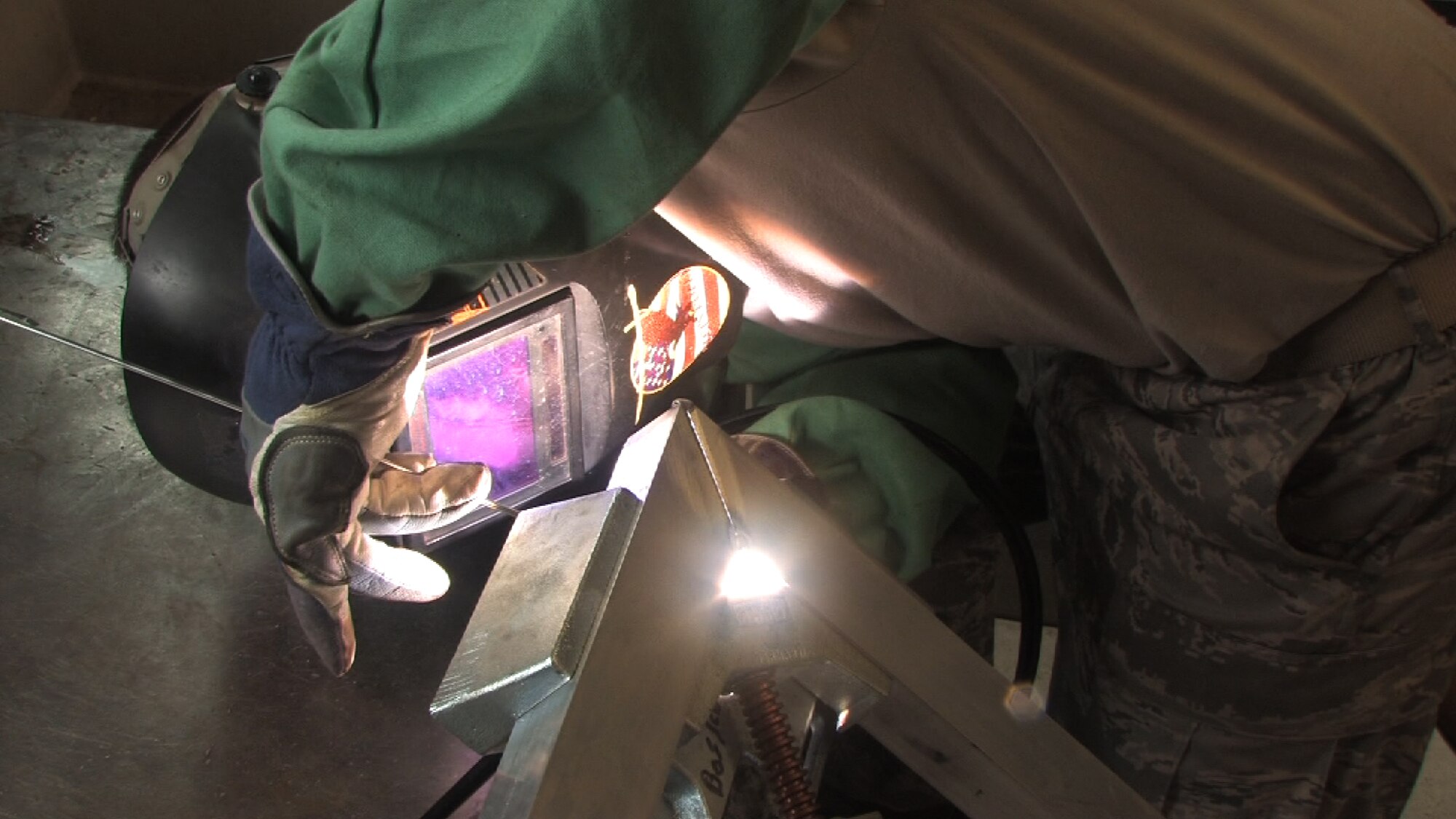 Staff Sgt. David Larva, 934th aircraft metal technologist, welds a Civil engineer gate door while on seasoning training.  Seasoning training gives Reservists who are recent technical school graduates the chance to receive on the job training for up to 90 days. (Air Force Photo/Wendy Cormier) 