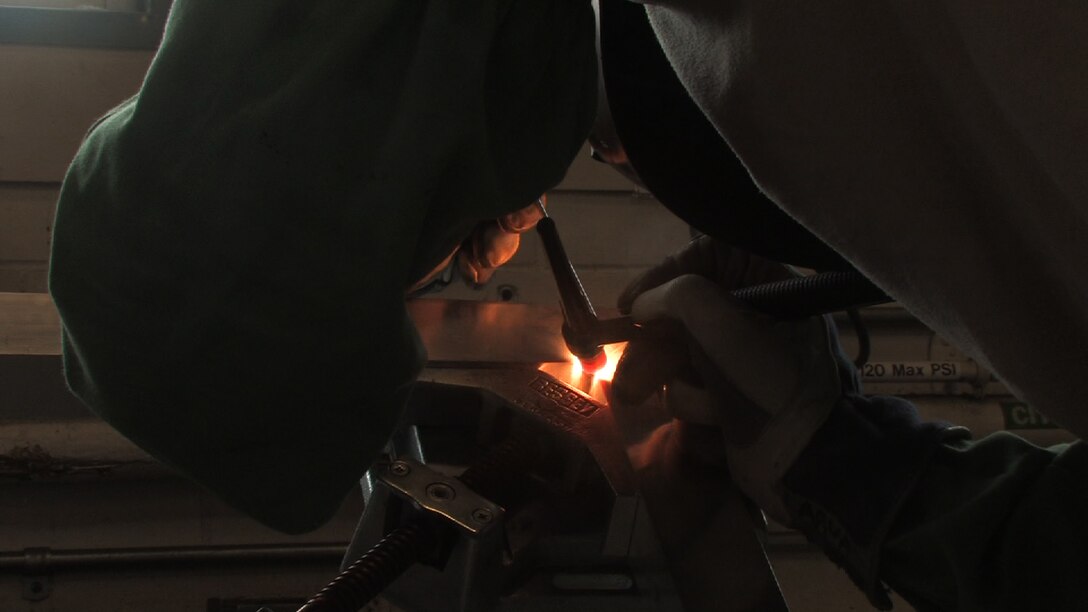 Staff Sgt. David Larva, 934th aircraft metal technologist, welds a Civil engineer gate door while on seasoning training.  Seasoning training gives Reservists who are recent technical school graduates the chance to receive on the job training for up to 90 days. (Air Force Photo/Wendy Cormier) 