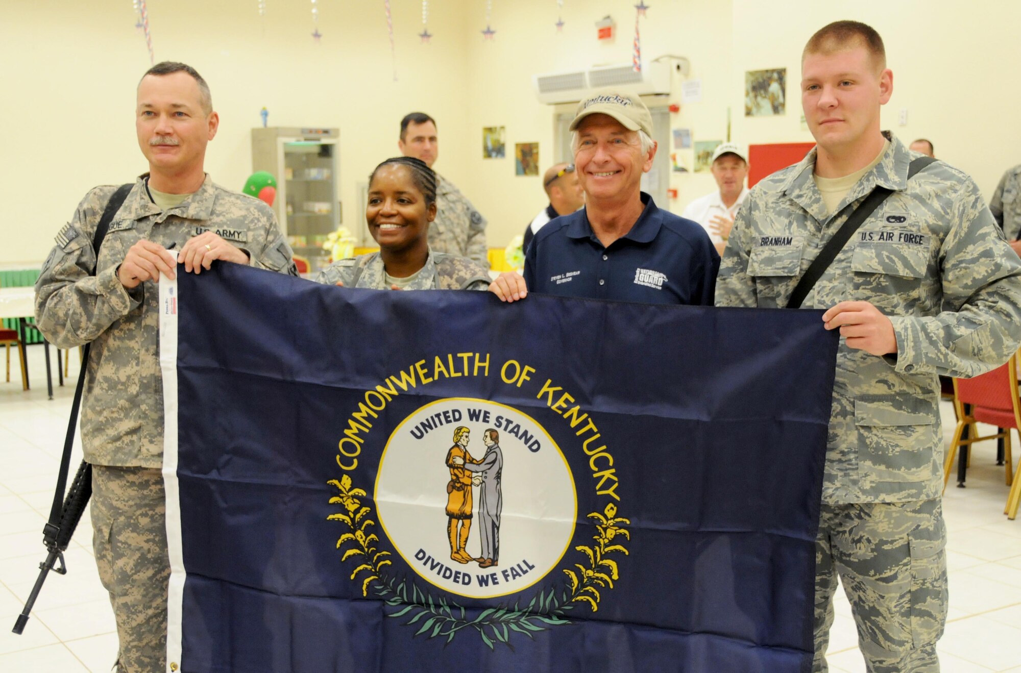 Kentucky Governor Steven Beshear poses for a picture with service members at Joint Base Balad, Iraq. Haslam along with governors from Utah, Kentucky and Nevada are traveling throughout U.S. Central Command to meet with service members from their states. (U.S. Air Force photo by Senior Airman Jeffrey Schultze)

 
