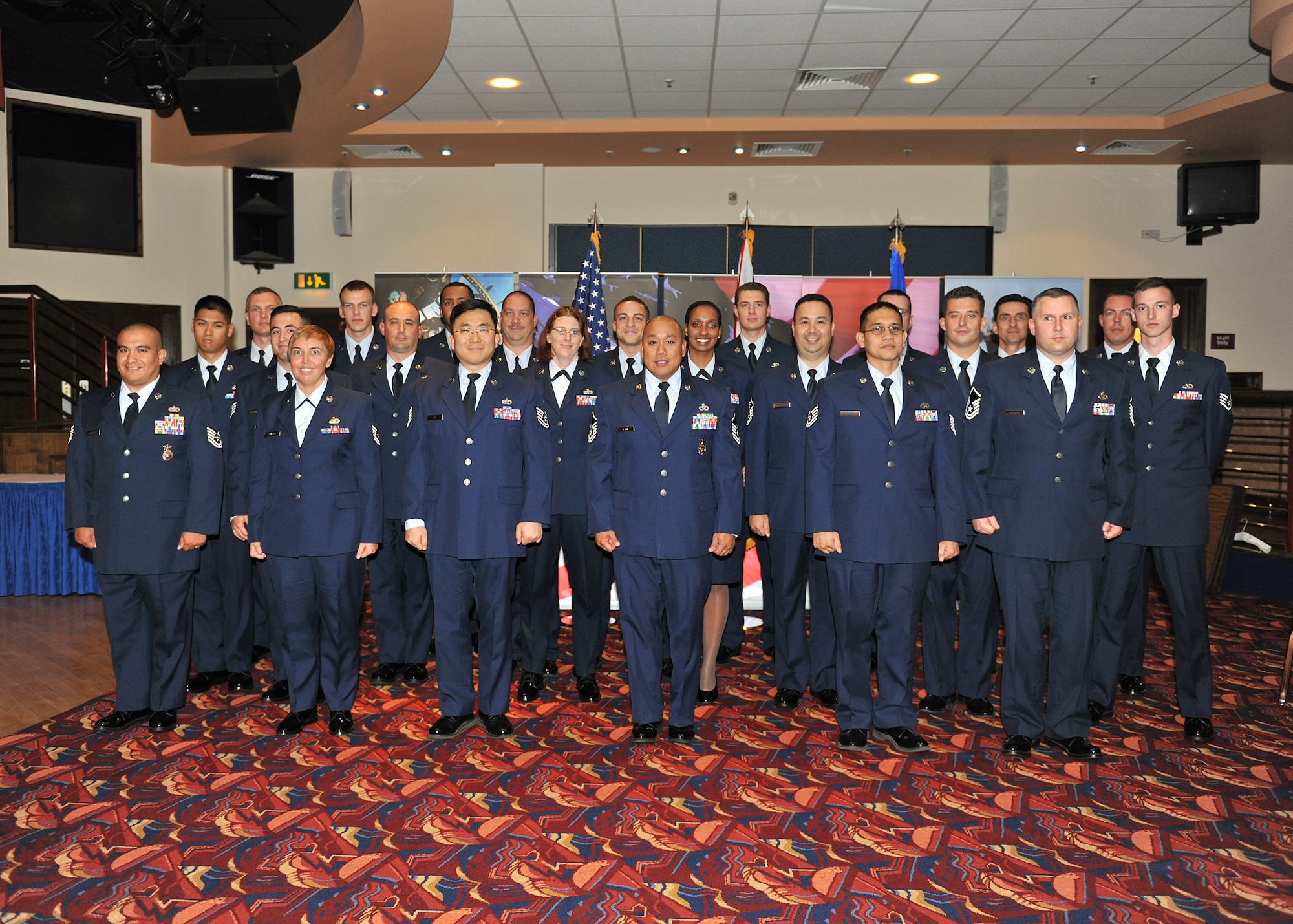 RAF MILDENHALL, England -- Some of Team Mildenhall’s newest promoties pose for a photo after the Team Mildenhall Promotion Ceremony here July 29, 2011.  Each month about 50 Airmen are promoted at RAF Mildenhall and units are encouraged to attend and recognize their Airmen for advancing to the next level of responsibility in their Air Force careers.  (U.S. Air Force photo/by Staff Sgt. Tabitha M. Lee)