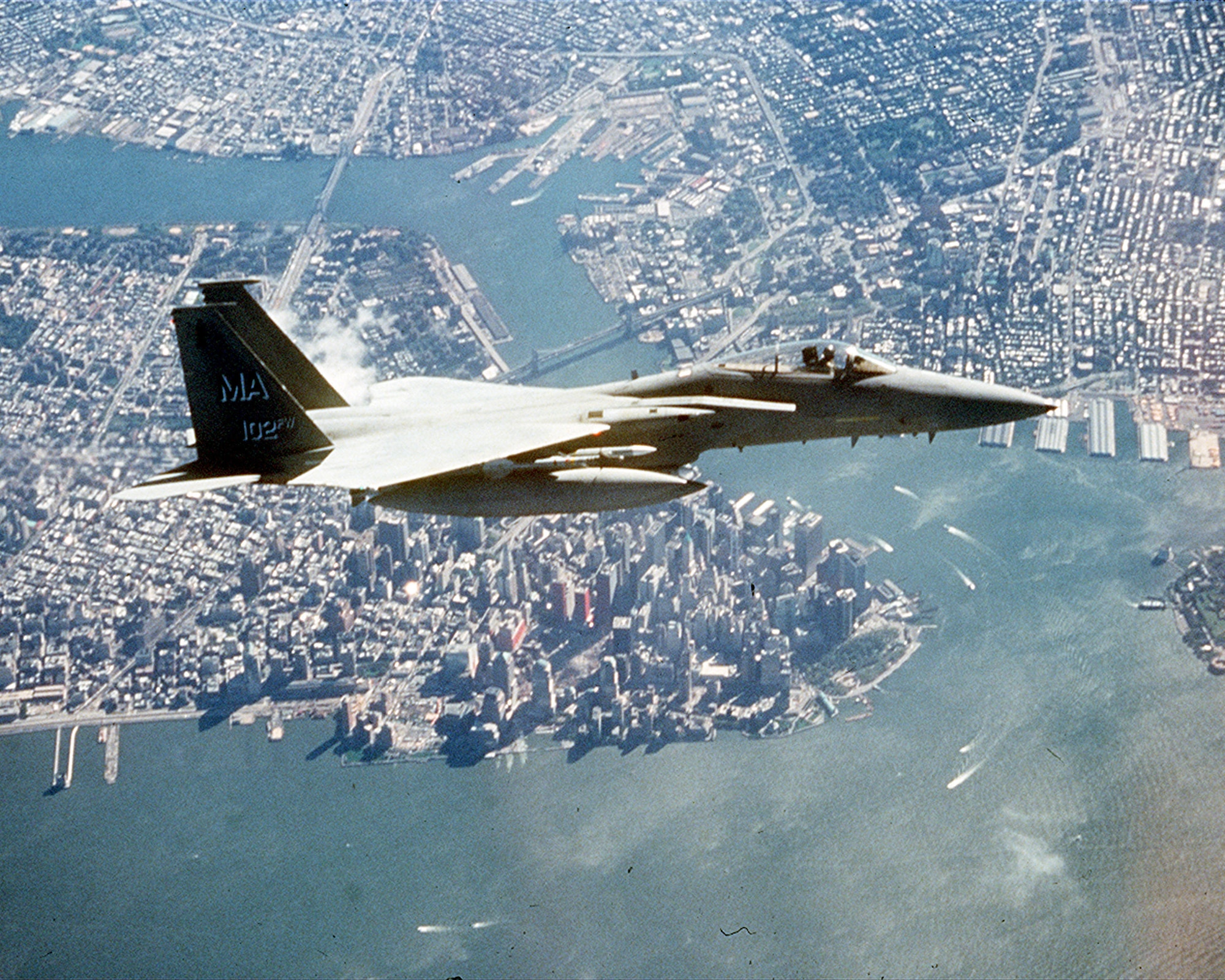 An F-15 flies over lower Manhattan and Ground Zero during an Operation Noble Eagle combat air patrol mission several months after the 9/11 attacks.  