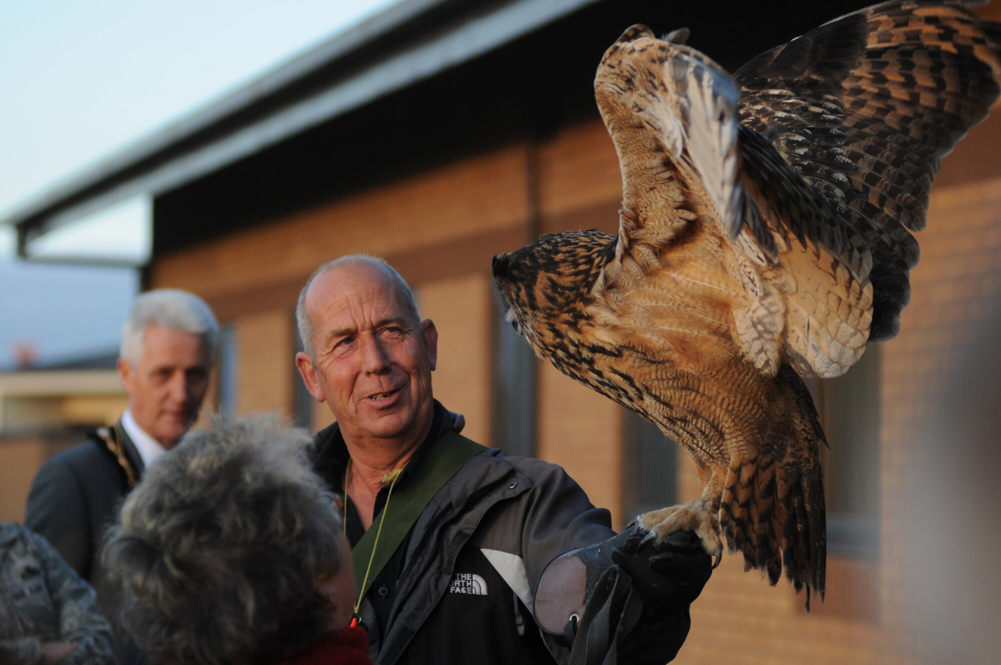 ROYAL AIR FORCE LAKENHEATH, England - Keith Mutton, Phoenix Bird Control falconer, holds Twinkle, a 24-year-old eagle owl, during a bird demonstration for the Honorary Commander's summer reception, July 29, 2011. The visitors, including seven new honorary commanders, were given a birds of prey demonstration, military working dog demonstration, F-15 take-offs and landings, de-contamination exercise, a barbecue amoung other activities. (U.S. Air Force photo/Airman Cory D. Payne)