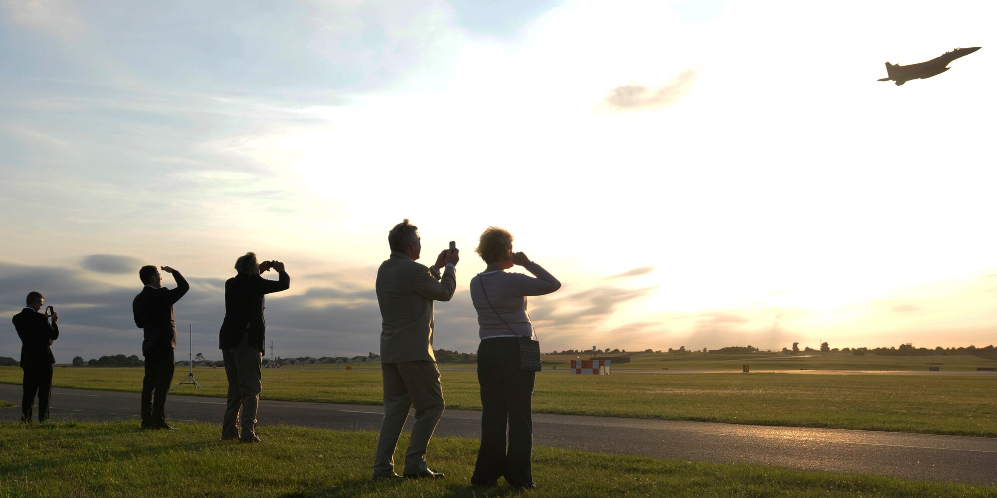 ROYAL AIR FORCE LAKENHEATH, England - Local community leaders and their guests observe F-15 flyovers for the Honorary Commander's summer reception  on RAF Lakenheath, July 29, 2011. The visitors, including seven new honorary commanders, witnessed a birds of prey demonstration, military working dog demonstration, F-15 take-offs and landings, de-contamination exercise and barbecue among other activities. (U.S. Air Force photo/Senior Airman Tiffany M. Deuel)