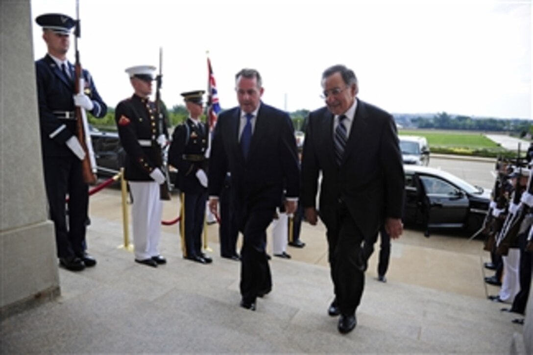 Secretary of Defense Leon E. Panetta (right) escorts United Kingdom Secretary of State for Defense Liam Fox through an honor cordon and into the Pentagon on Aug. 1, 2011.  Panetta and Fox are scheduled to discuss a wide range of security issues.  