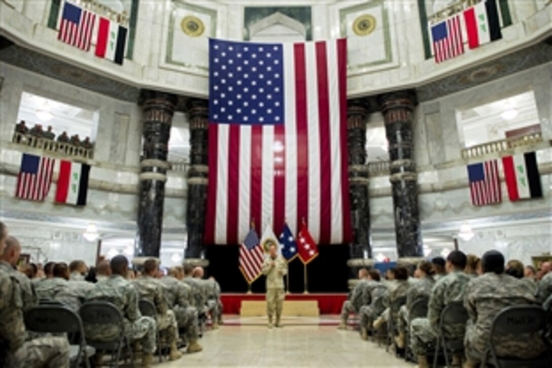 U.S. Navy Adm. Mike Mullen, chairman of the Joint Chiefs of Staff, addresses troops during an all-hands call at Al Faw Palace in Baghdad, Aug. 2, 2011. Mullen is on a five-day USO tour with comedian Jon Stewart, NBA Legend Karl Malone and magician David Blaine visiting troops in Afghanistan and Iraq.