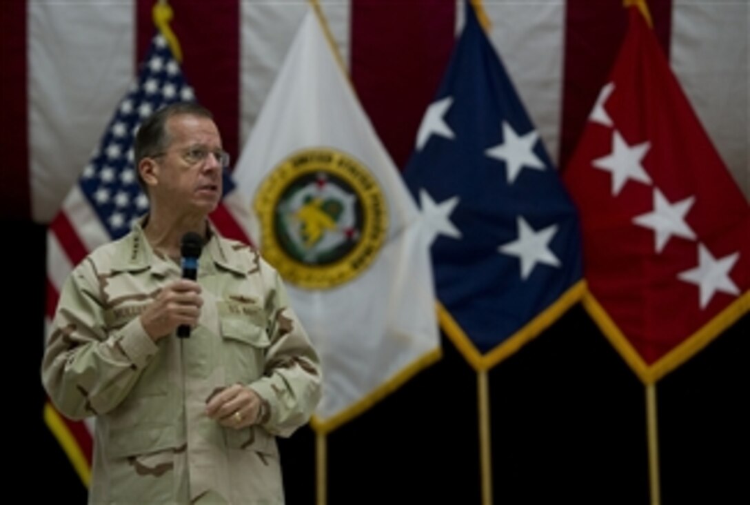 Chairman of the Joint Chiefs of Staff Adm. Mike Mullen addresses service members during an all hands call at Al-Faw Palace, Baghdad, Iraq, on Aug. 2, 2011.  Mullen is on a five-day USO tour with comedian Jon Stewart, NBA legend Karl Malone and magician David Blane visiting troops in Afghanistan and Iraq.  