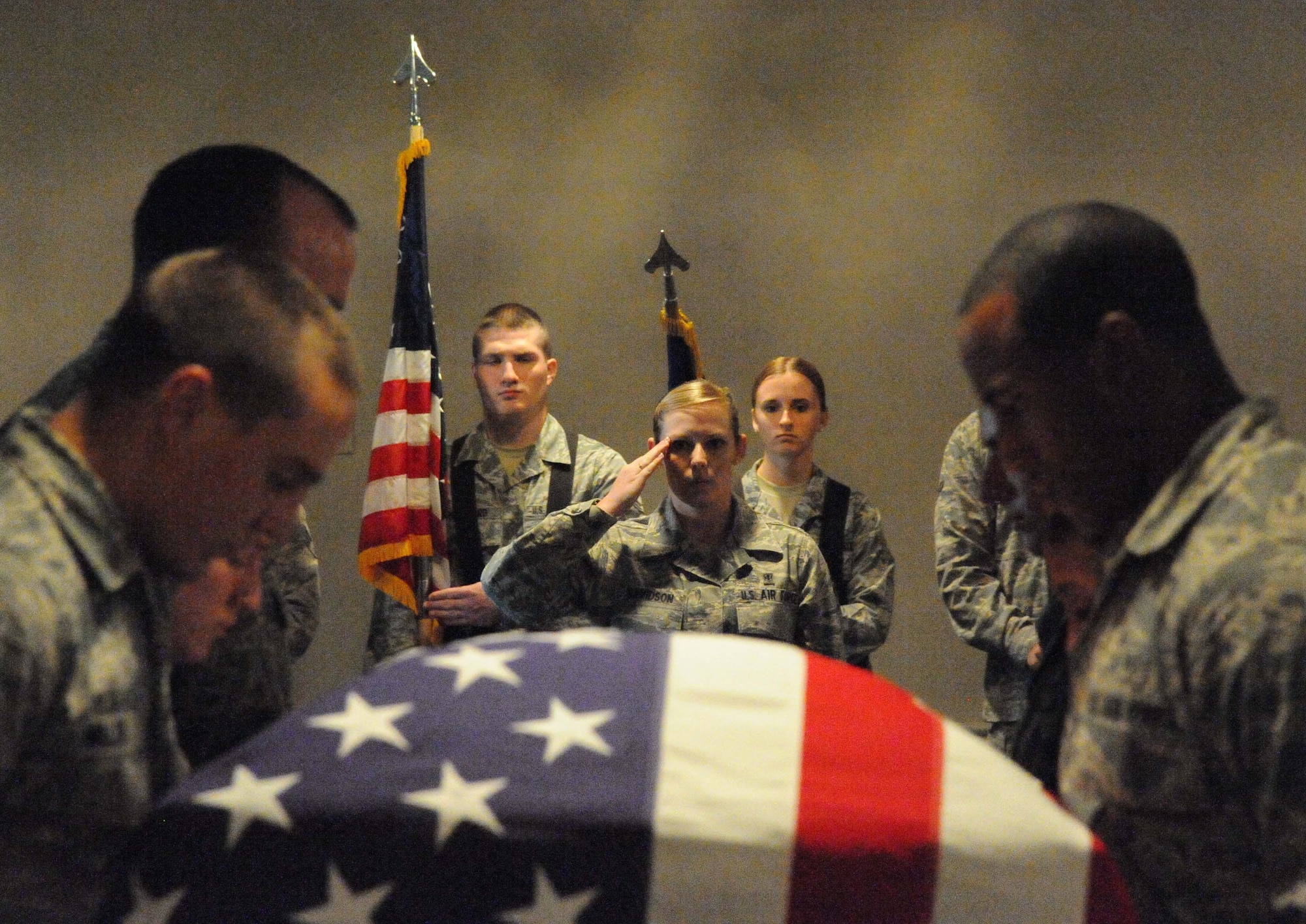 LAUGHLIN AIR FORCE BASE, Texas – Airman 1st Class Kathleen Davidson, 47th Medical Support Squadron, salutes an empty casket during a mock-military funeral performed by Laughlin’s Honor Guard at Club XL Aug. 3. Members of the Air Force Honor Guard from Bolling Air Force Base in Washington, D.C. trained the Laughlin Honor Guard members from July 25 until Aug. 3. (U.S. Air Force photo by Airman 1st Class Blake Mize)
