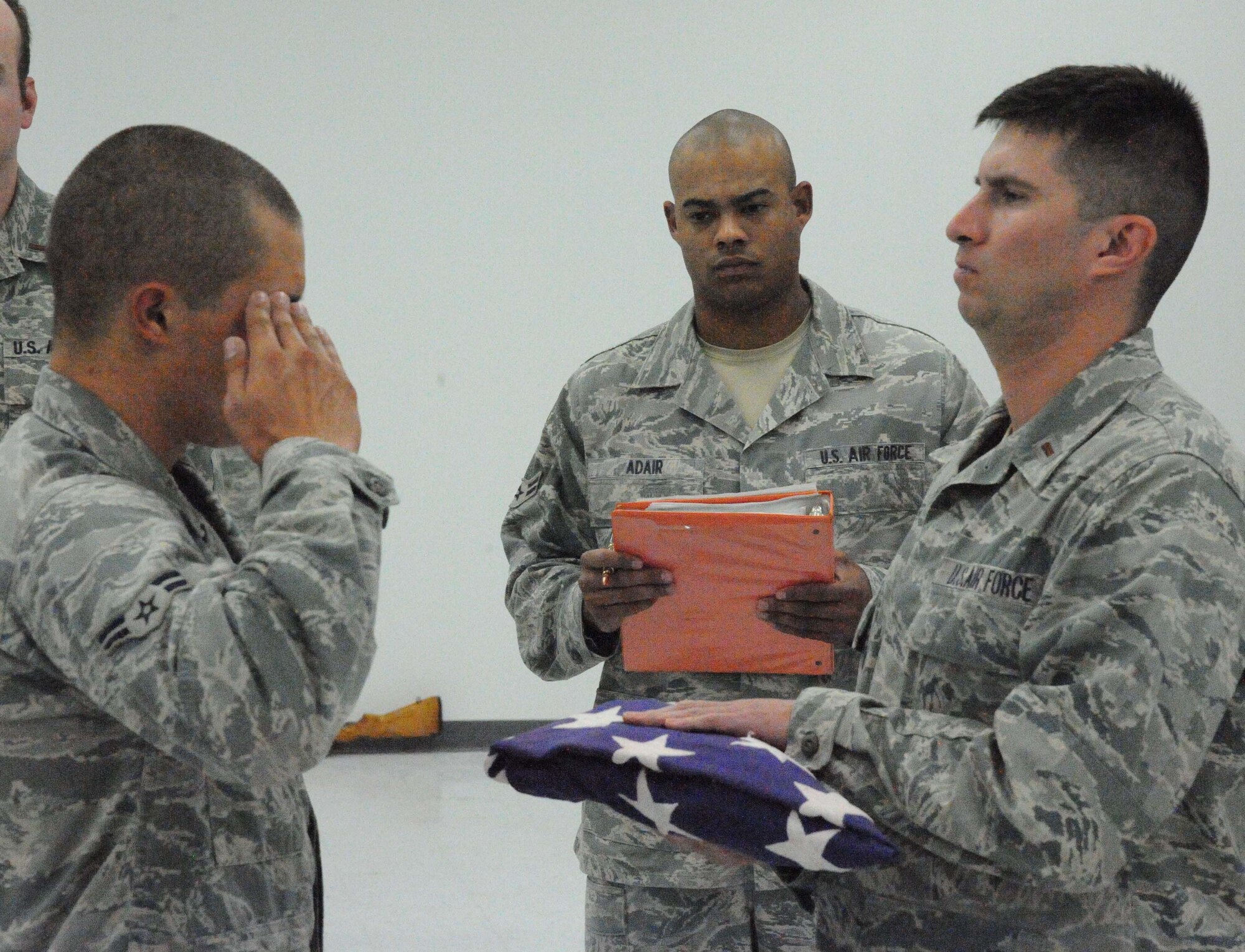 LAUGHLIN AIR FORCE BASE, Texas – Airman 1st Class Jarrett Adair, of the Air Force Honor Guard, evaluates members of Laughlin’s Honor Guard during a mock-military funeral here Aug. 3. Members of the Air Force Honor Guard from Bolling Air Force Base in Washington, D.C. trained the Laughlin Honor Guard members from July 25 until Aug. 3. (U.S. Air Force photo by Airman 1st Class Blake Mize)