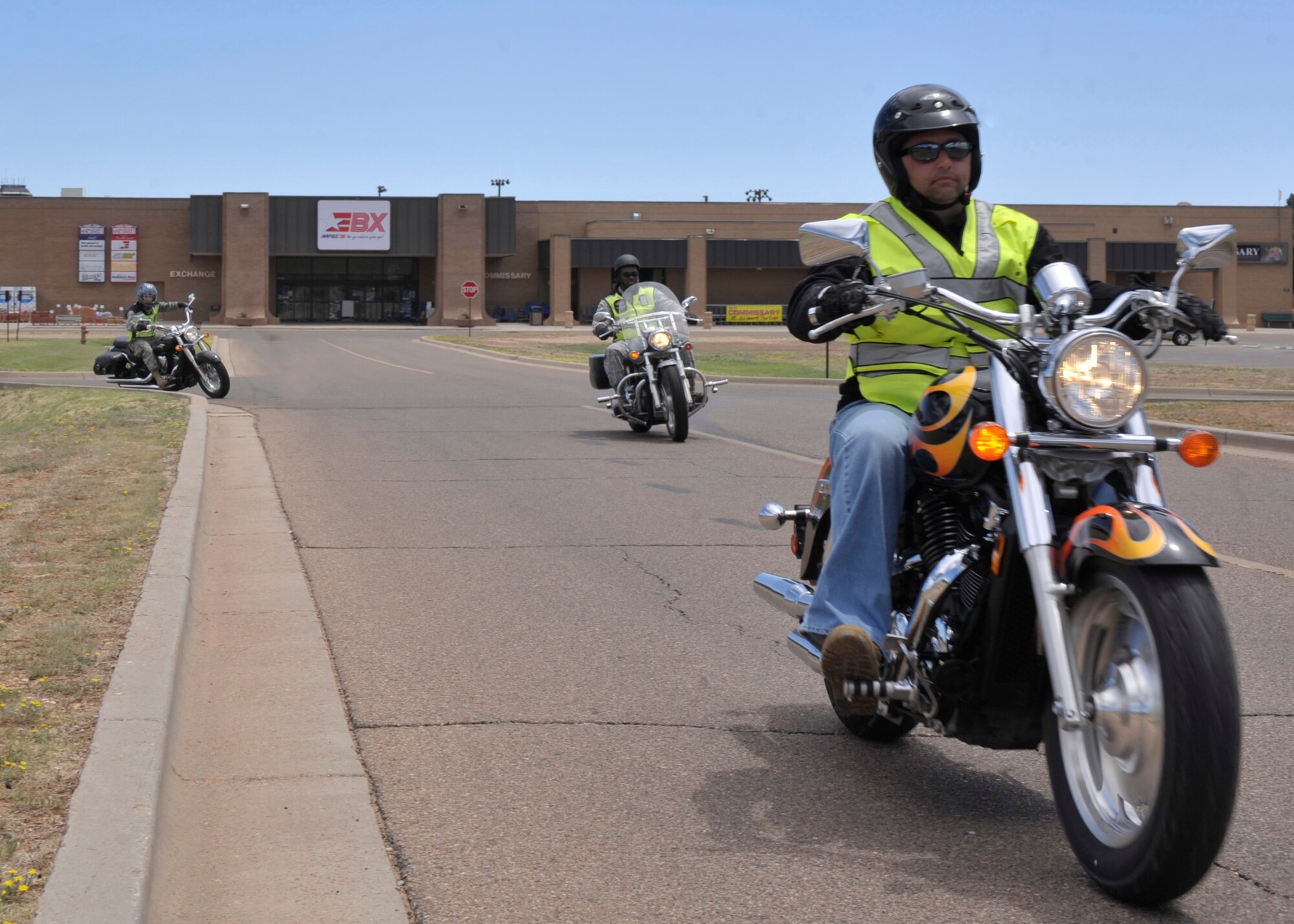 Participants in the base's first official motorcycle safety rally ride out of the Base Exchange parking lot at Cannon Air Force Base, N.M., Aug. 1, 2011. More than 30 riders participated in the rally, which consisted of a safety briefing by Brian Sapp, co-creator of the 27th Special Operations Wing Rolling Eagles motorcycles riders group, and a 2-hour group ride. (U.S. Air Force photo by Airman Ericka Engblom)