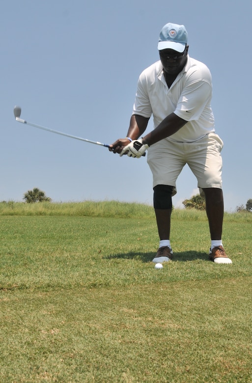 Sgt. Kevin Bessellieu prepares a chip shot, Aug. 2, 2011, at Kiawah Island, S.C., during a Professional Golfers Association of America military appreciation event. The event was held to announce that active duty military will be able to attend the 2012 PGA Championship free of charge. Bessellieu is from the 841st Transportation Battalion. (U.S. Air Force photo/Airman 1st Class Jared Trimarchi) 