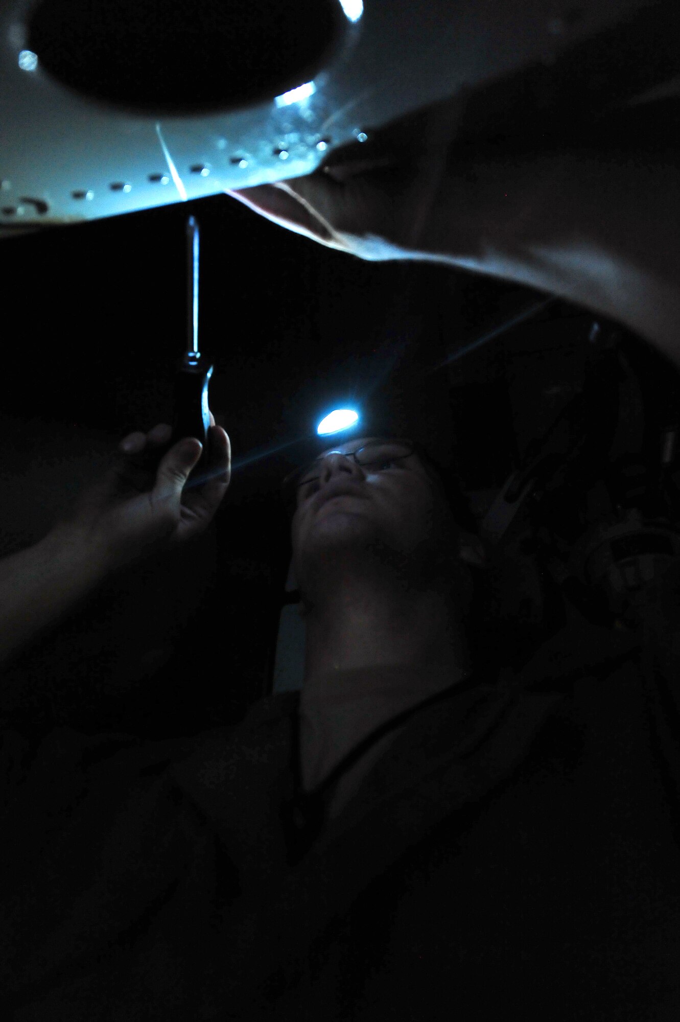 MINOT AIR FORCE BASE, N.D. -- Staff Sgt. Jordan Ellis, 5th Aircraft Maintenance Squadron aircraft armament systems technician, examines for visual defects and proper installation of systems components during a routine inspection of a B-52H Stratofortress, here Aug. 3. Aircraft armament systems technicians plan, organize and direct maintenance activities by performing armament systems maintenance functions tests before connecting electrically actuated explosives and propellants to effectively achieve mission success. (U.S. Air Force Photo/Senior Airman Jesse Lopez) 