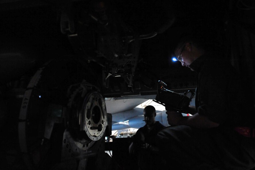 MINOT AIR FORCE BASE, N.D. -- Staff Sgt. Jordan Ellis, 5th Aircraft Maintenance Squadron aircraft armament systems technician and Tech Sgt. Iickyra Jones, 5th AMXS aircraft armament systems team chief, examines for visual defects and proper installation of systems components during a routine inspection of a B-52 Stratofortress, here Aug. 3. Aircraft armament systems technicians plan, organize and direct maintenance activities by performing armament systems maintenance functions tests before connecting electrically actuated explosives and propellants to effectively achieve mission success. (U.S. Air Force Photo/Senior Airman Jesse Lopez) 
