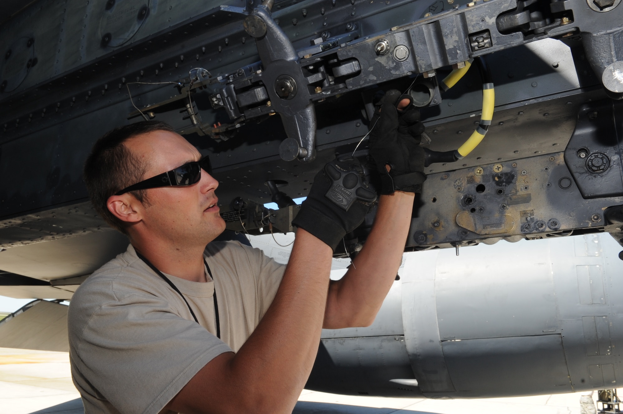 MINOT AIR FORCE BASE, N.D. – Senior Airman Cody McConnell, 5th Aircraft Maintenance Squadron weapons loader, downloads weapons from a B-52H Stratofortress here Aug. 2. As part of Air Force Global Strike Command, weapons loaders work endlessly to preserve our nation’s security by providing combat-ready forces for nuclear deterrence and global strike operations. (U.S. Air Force photo/ Senior Airman Aaron-Forrest Wainwright) 