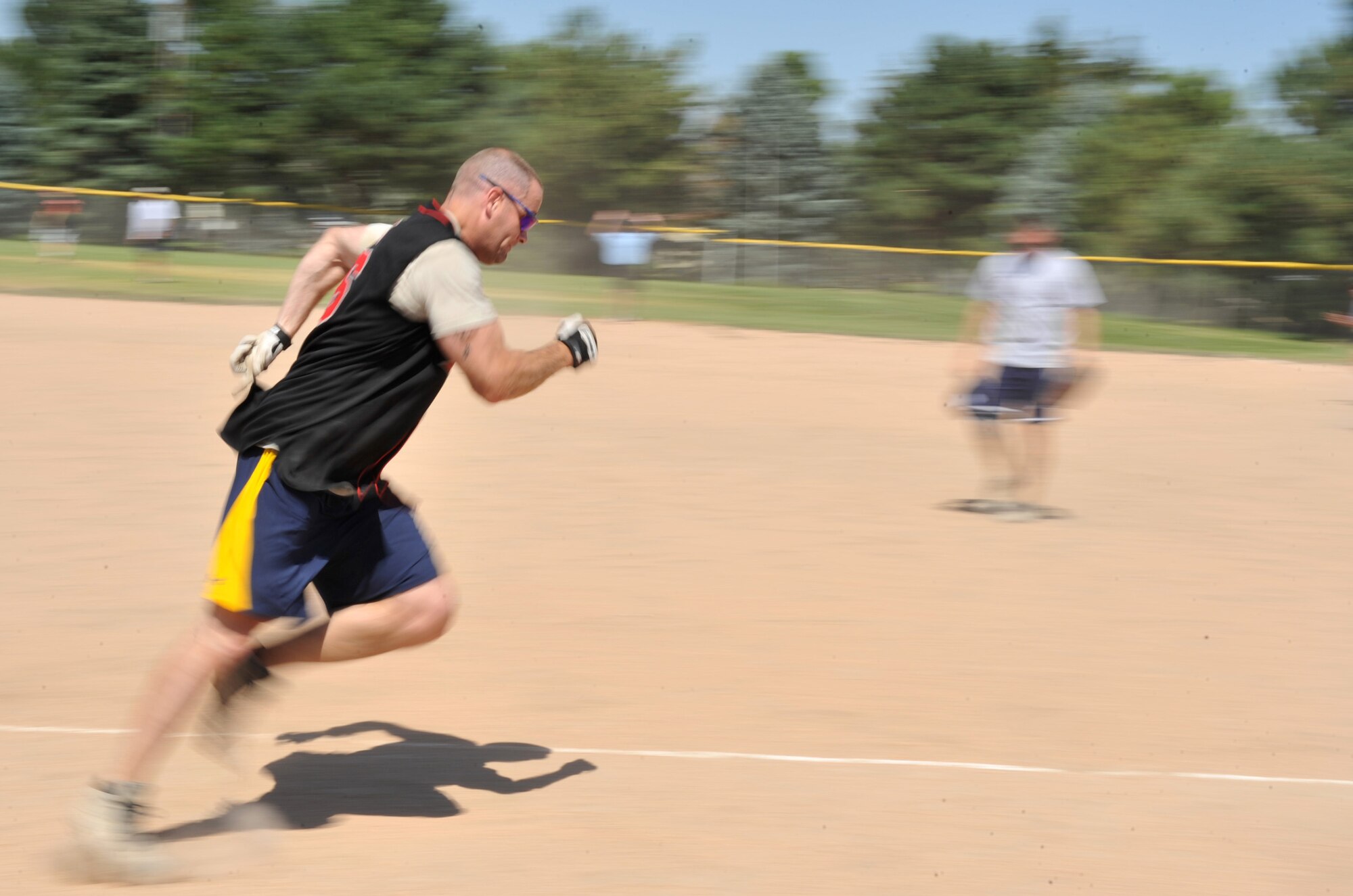 MOUNTAIN HOME AIR FORCE BASE, Idaho  – Capt. Keith Quick, 366th Security Forces Squadron commander, runs to home plate during the Operation Warmheart softball tournament here, July 29. The tournament featured around-the-clock games beginning Friday and ending Sunday. (U.S. Air Force photo by Airman 1st Class Heather Hayward)