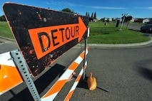MINOT AIR FORCE BASE – Contractors repair pot holes and reconstruct the road along Missile Avenue to the front gate, resulting in detours through base housing, here Aug. 02. This project will improve the roads on base as well as add a turning lane to relieve the traffic surrounding the shoppette. (U.S. Air Force Photo/ Senior Airman Jesse Lopez)