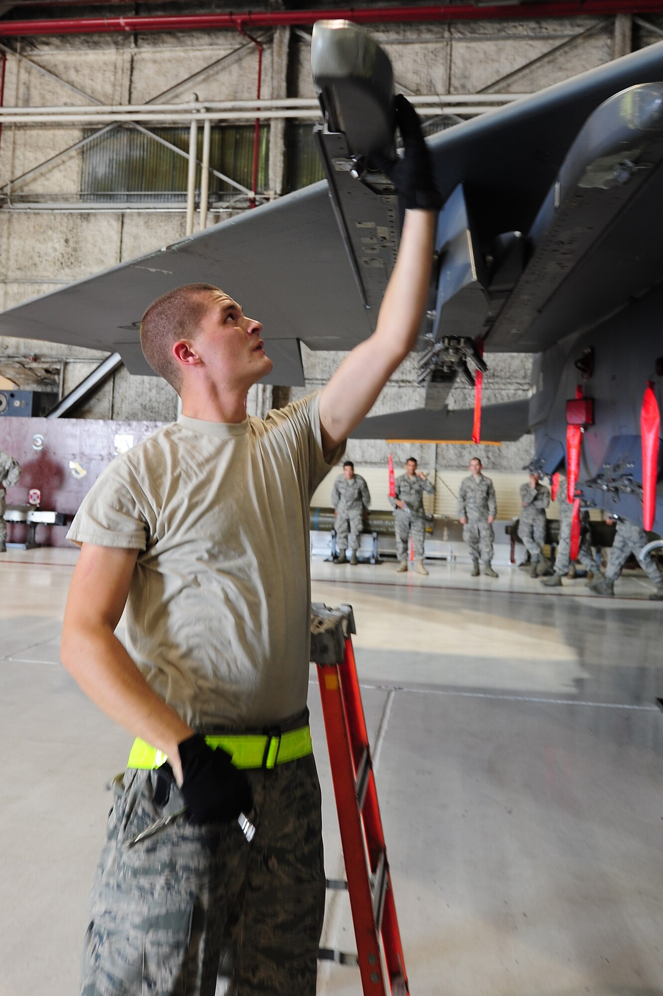 SEYMOUR JOHNSON AIR FORCE BASE, N.C. – Senior Airman Curtis Benson checks a LAU-128 missile launcher on an F-15E Strike Eagle during a quarterly load crew competition here July 29, 2011. Airmen check munitions racks for serviceability before munitions are loaded onto them. Benson, 336th Aircraft Maintenance Unit weapons load crew three-man, is a native of Newton. (U.S. Air Force photo by Senior Airman Rae Perry/RELEASED) 