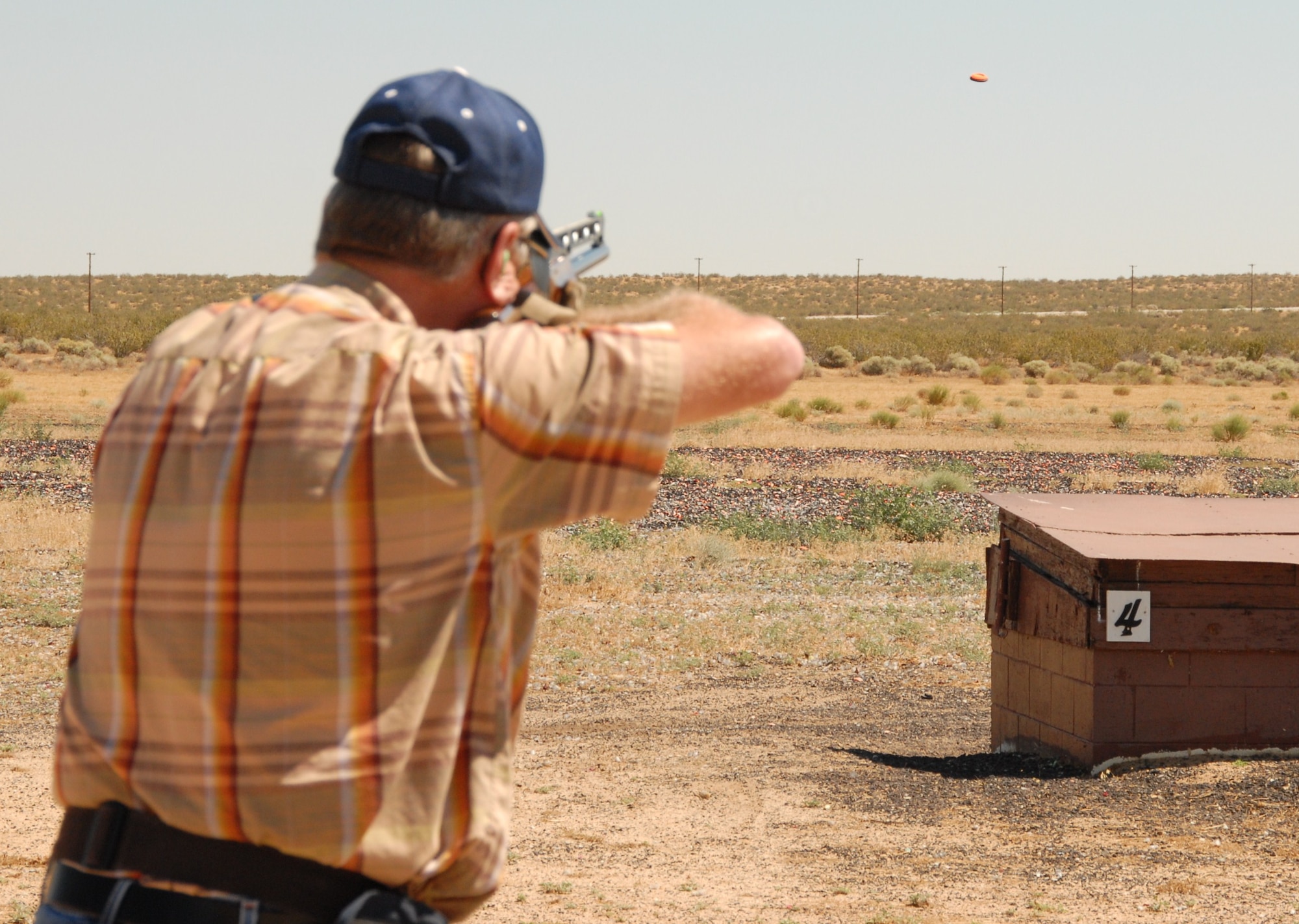 A skeet shooter aims to hit a clay pigeon at the Edwards Rod and Gun Club, which is one of nine facilities featured on the Air Force Material Command-sponsored program, “Take a Trek Thru Outdoor Rec.” Participants pick up a treasure map from Outdoor Recreation and travel to different ODR facilities on base for a chance to win the grand prize, which is a $500 95th Force Support Squadron gift card. Second prize is a GPS unit. The program runs Aug. 14-20. (Air Force Photo by Melissa Buchanan)