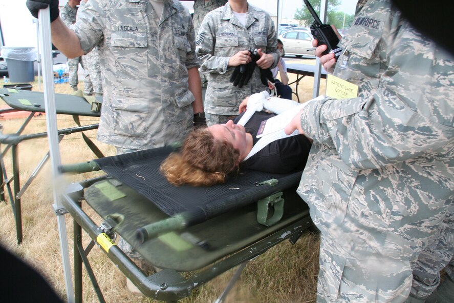 914th Aeromedical Staging Squadron Airmen participate in a mass casualty exercise during the July Unit Training Assembly at the Niagara Falls Air Reserve Station, N.Y.  July 25.To ensure readiness for the upcoming 2011 Thunder of Niagara Air Show, the exercise consisted of medical teams responding to multiple scenarios that could happen at any public event on base.  (U.S. Air Force courtesy photo by Tech Sgt. Jaimelynn Winkler)