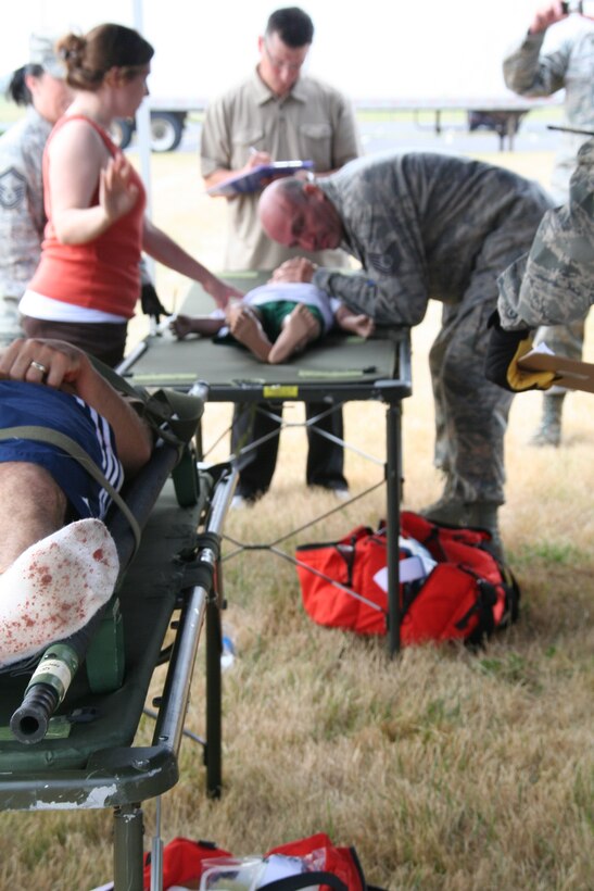 914th Aeromedical Staging Squadron Airmen participate in a mass casualty exercise during the July Unit Training Assembly at the Niagara Falls Air Reserve Station, N.Y.  July 25.To ensure readiness for the upcoming 2011 Thunder of Niagara Air Show, the exercise consisted of medical teams responding to multiple scenarios that could happen at any public event on base.  (U.S. Air Force courtesy photo by Tech Sgt. Jaimelynn Winkler)